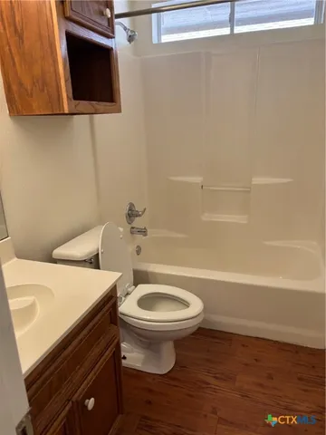a bathroom with a sink a toilet and a bathtub