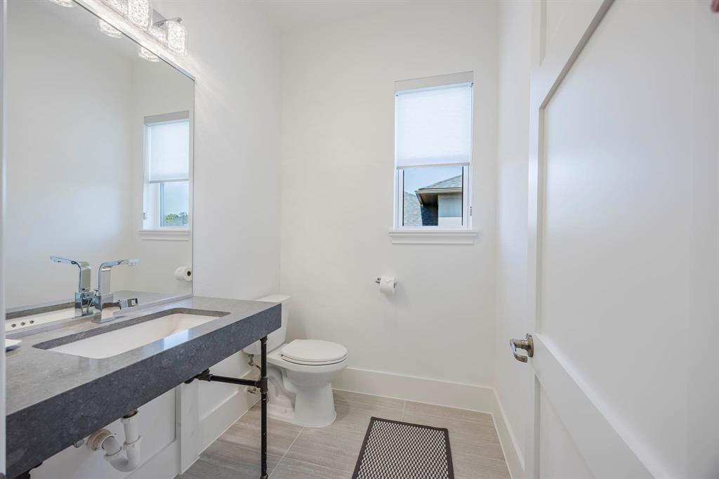 2081 Holt Way Grapevine, TX 76051 - Photo 26 of 40 a bathroom with a sink a toilet and shower