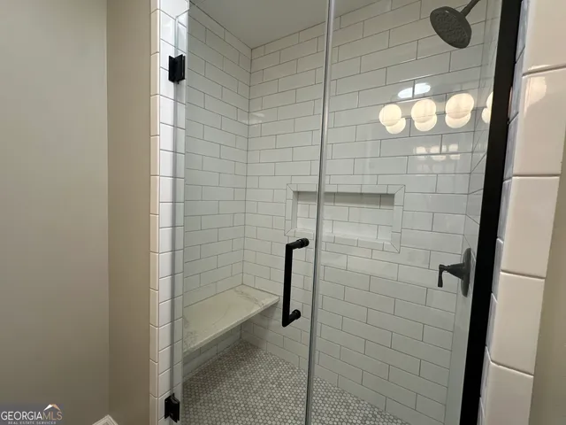 a bathroom with a sink and a shower