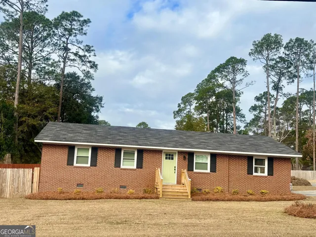 a front view of a house with yard