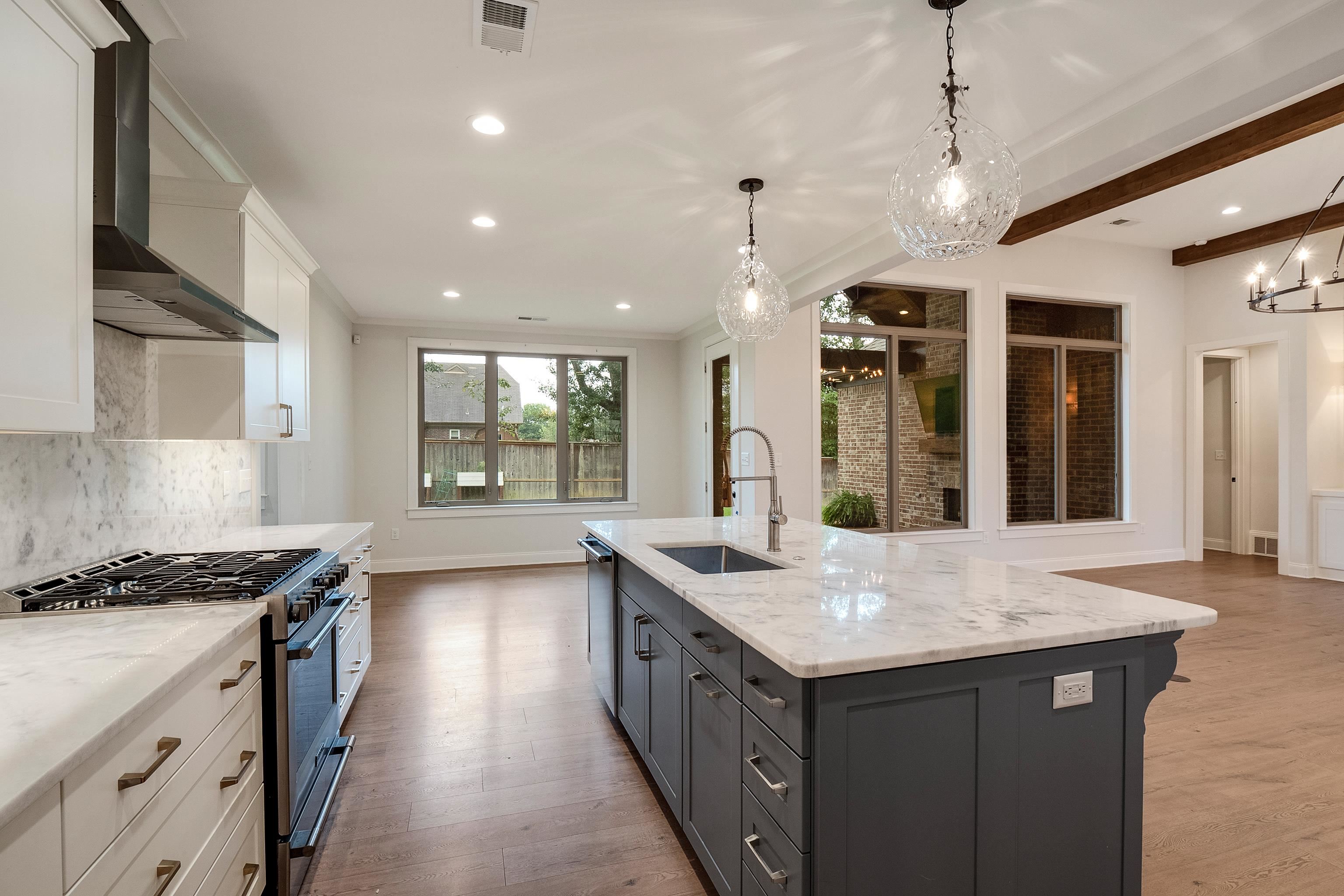 1365 Belfair Drive Collierville, TN 38017 - Photo 11 of 39 a kitchen with granite countertop counter space a sink stainless steel appliances and windows