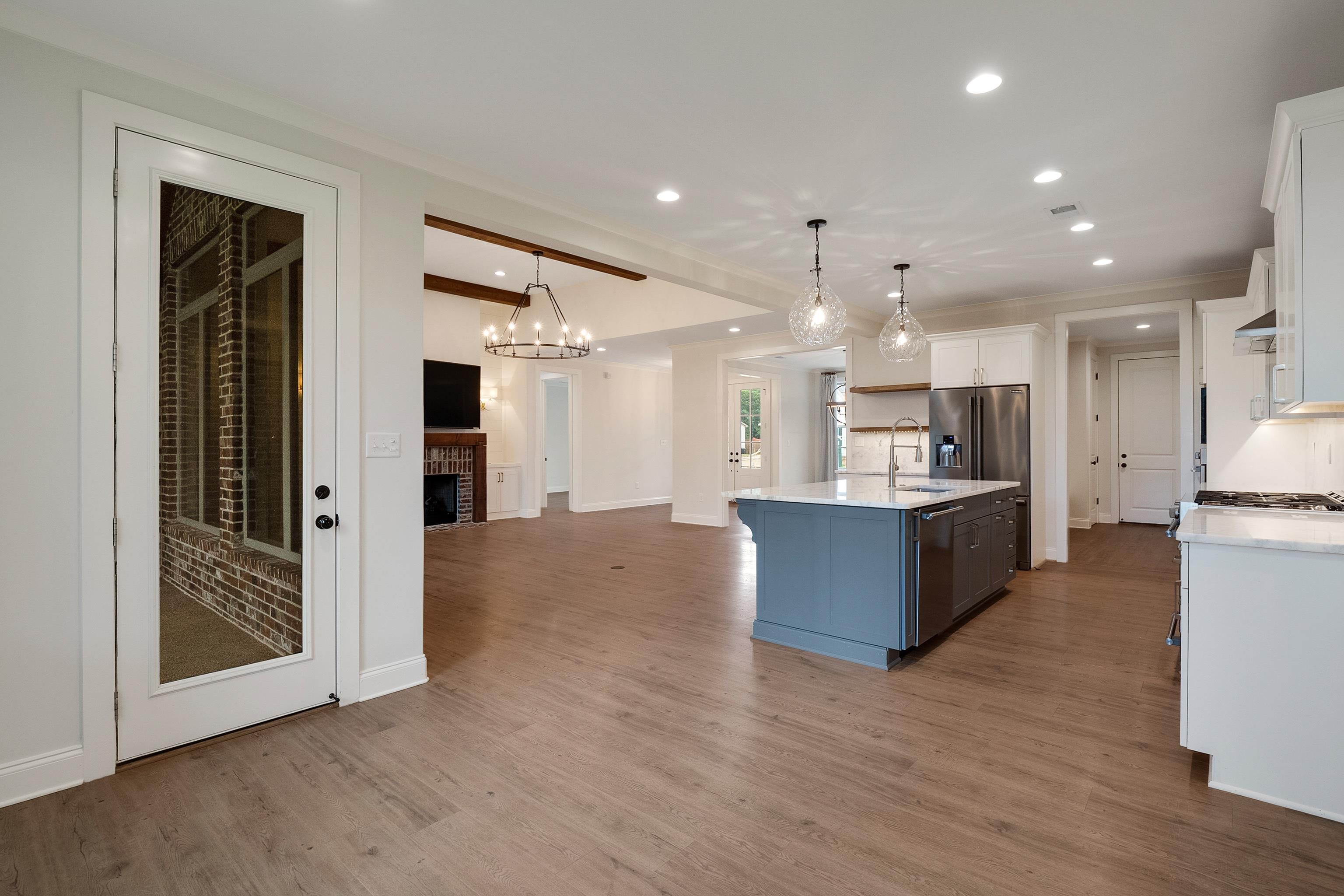 1365 Belfair Drive Collierville, TN 38017 - Photo 13 of 39 a large kitchen with a large counter top and stainless steel appliances