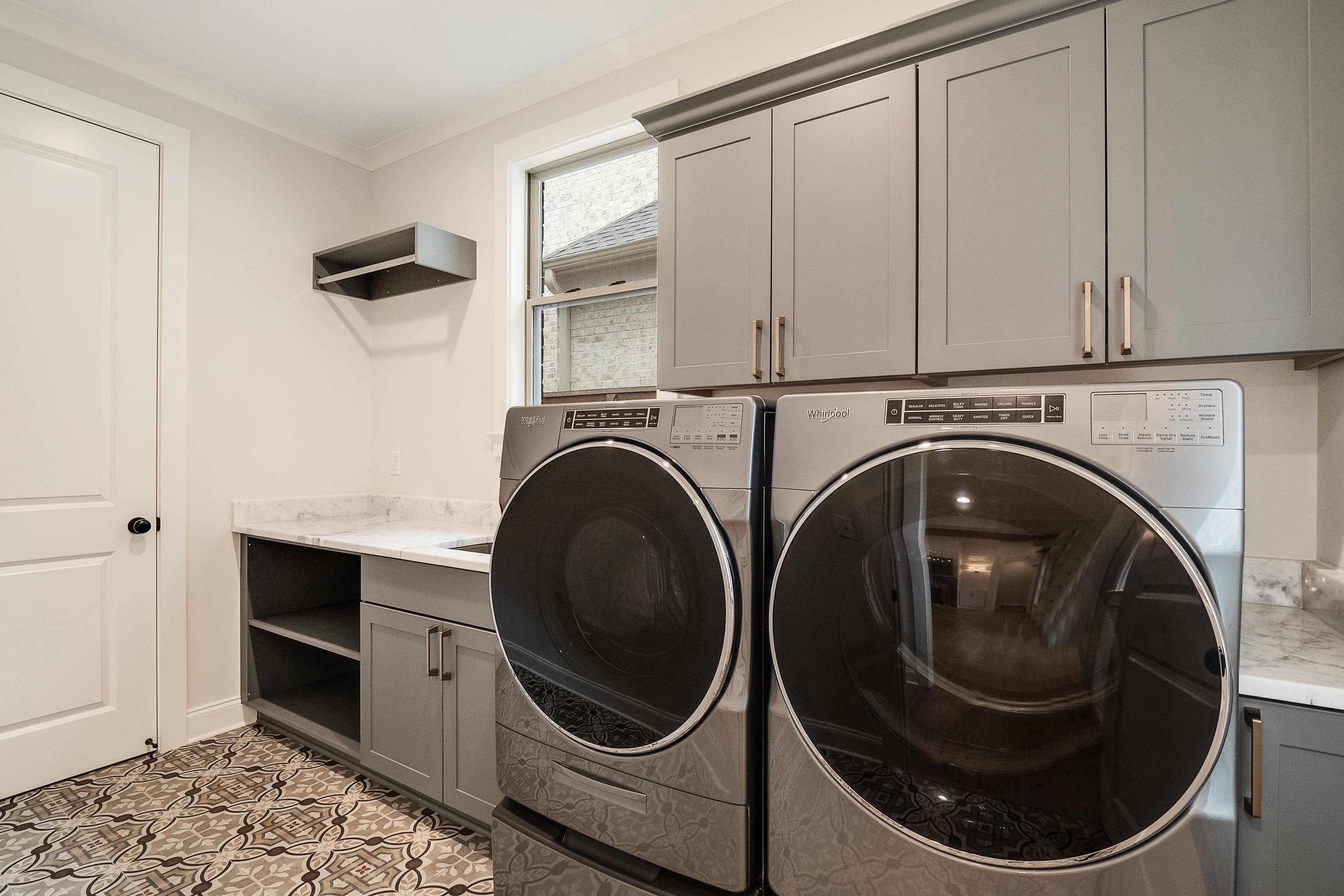 1365 Belfair Drive Collierville, TN 38017 - Photo 14 of 39 a utility room with dryer and washer