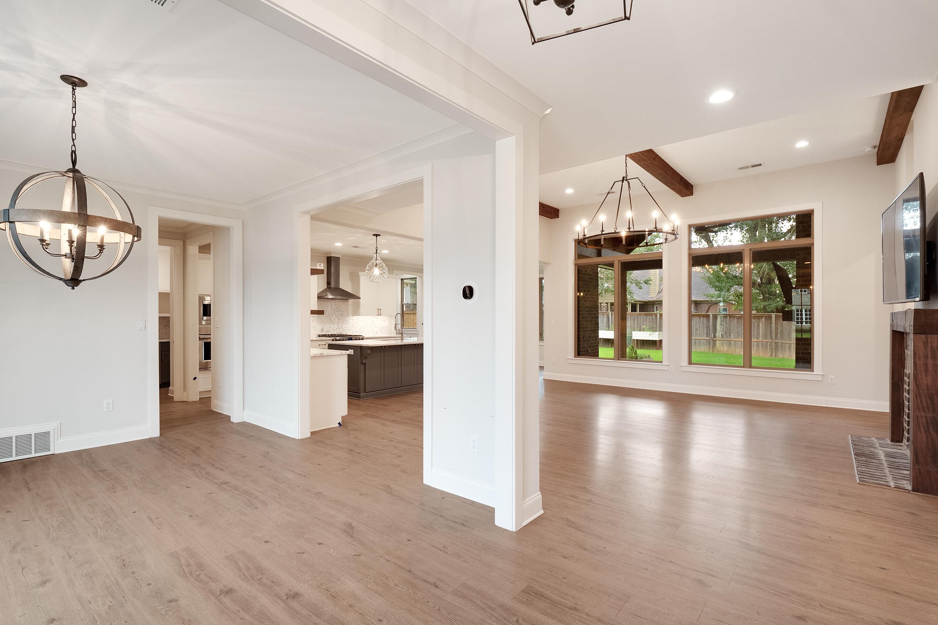 1365 Belfair Drive Collierville, TN 38017 - Photo 2 of 39 an empty room with wooden floor and windows