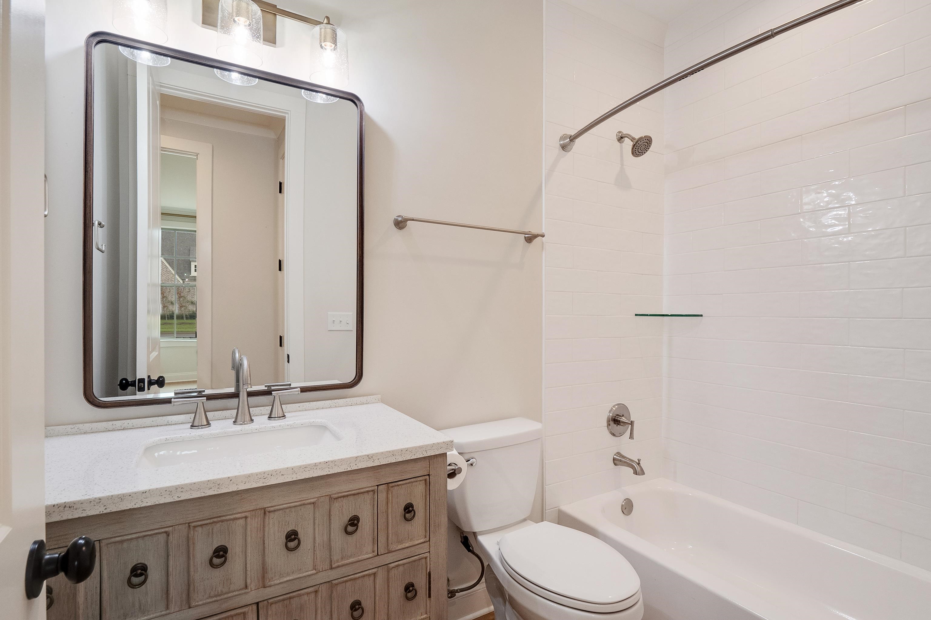 1365 Belfair Drive Collierville, TN 38017 - Photo 22 of 39 a bathroom with a granite countertop sink toilet and shower