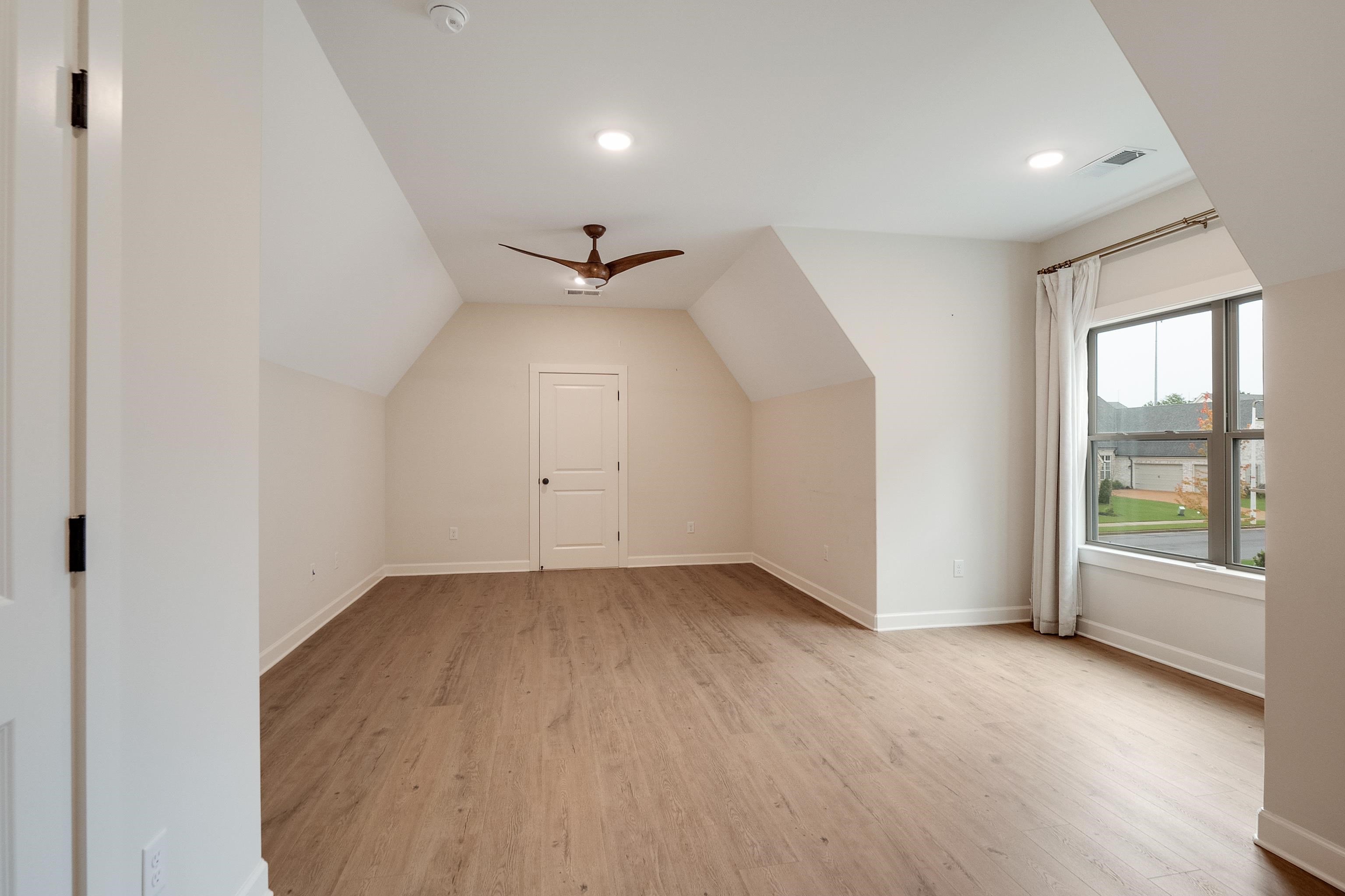 1365 Belfair Drive Collierville, TN 38017 - Photo 29 of 39 wooden floor in an empty room with a window