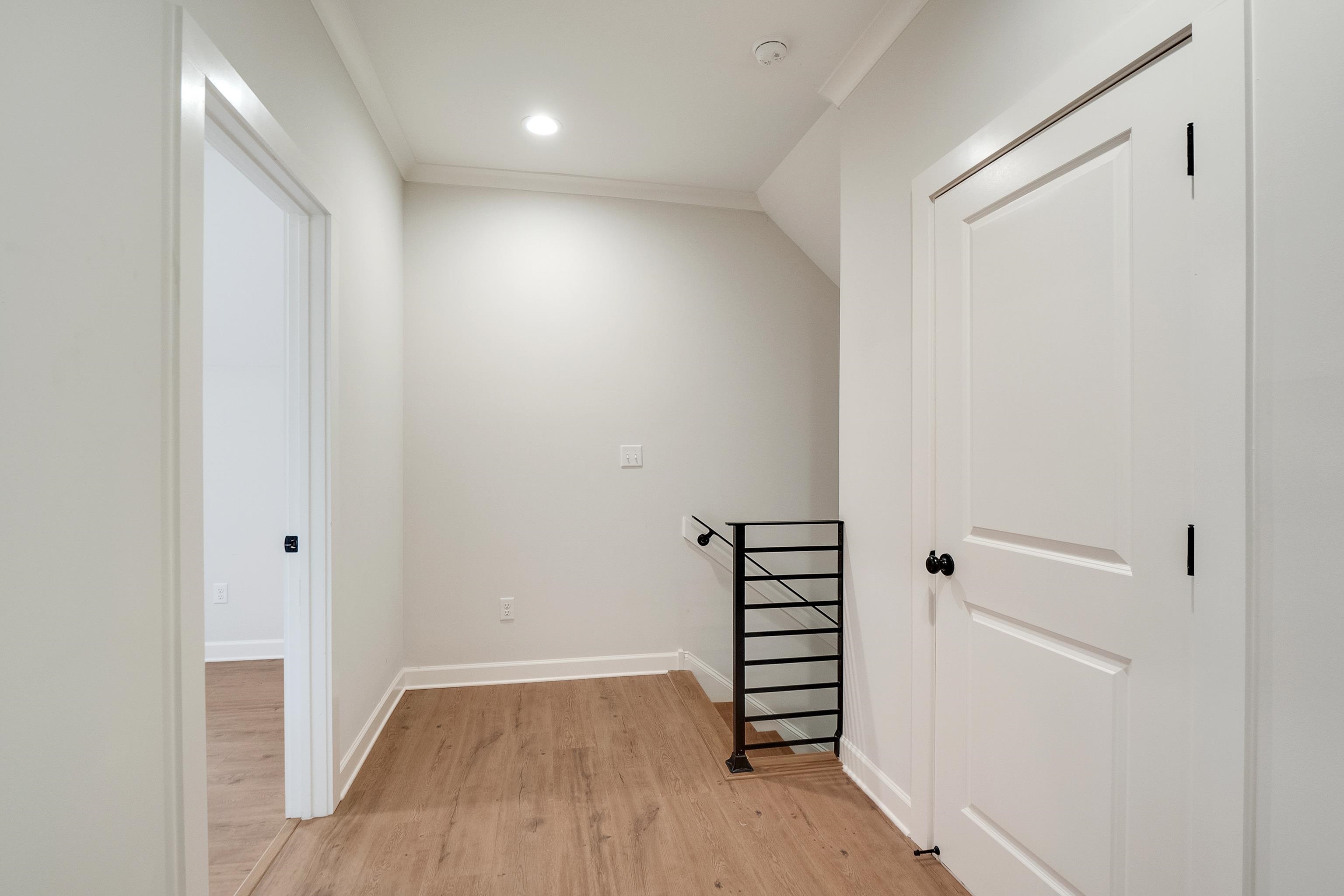 1365 Belfair Drive Collierville, TN 38017 - Photo 31 of 39 a view of room with stairs and wooden floor