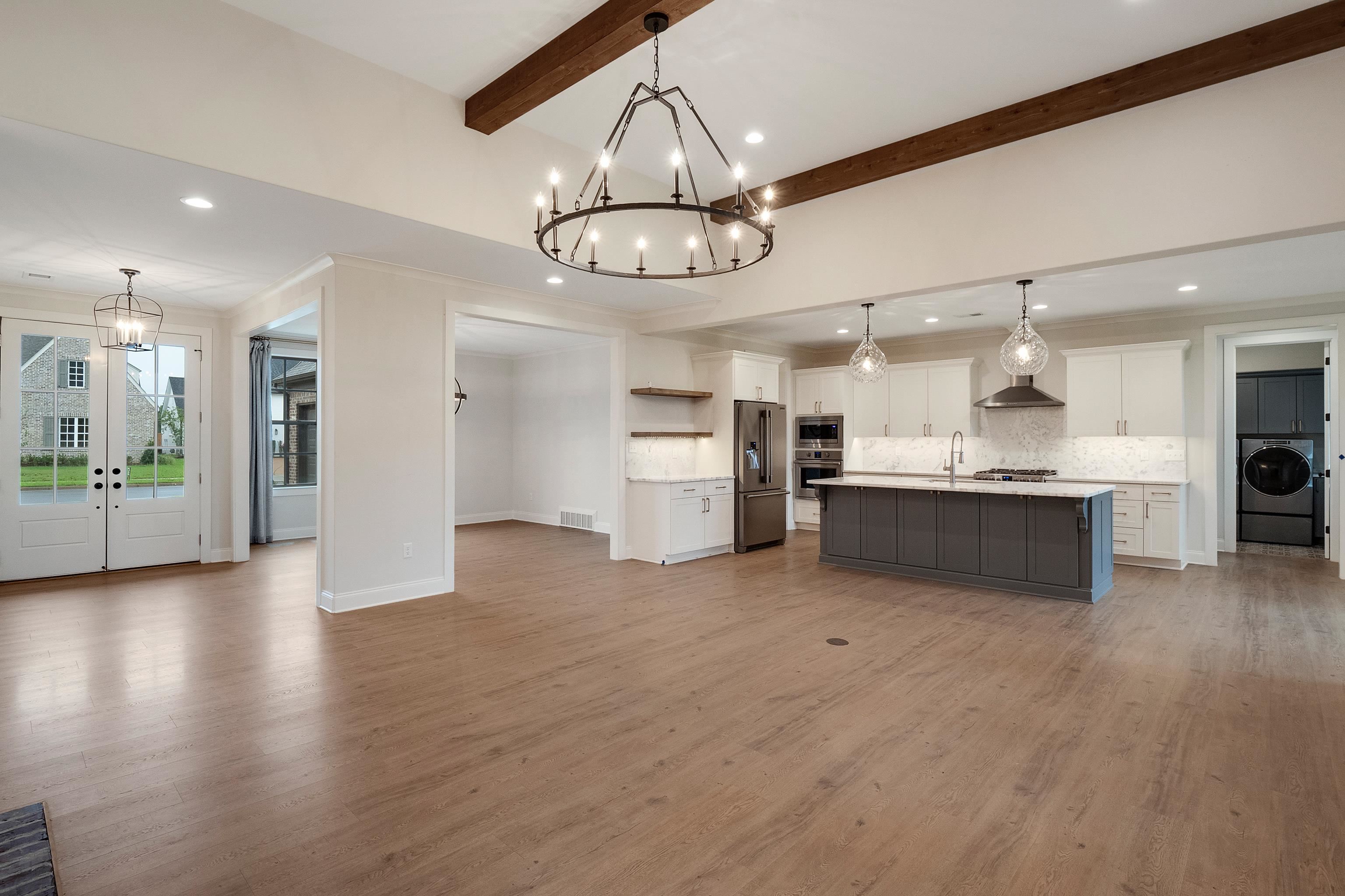 1365 Belfair Drive Collierville, TN 38017 - Photo 7 of 39 a view of a kitchen with a sink stainless steel appliances and cabinets