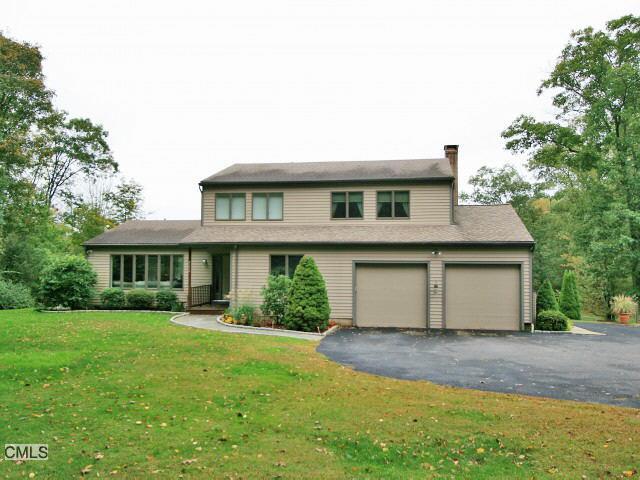 149 Newgate Road Oxford, CT 06478 - Photo 1 of 1 a front view of a house with a yard and trees