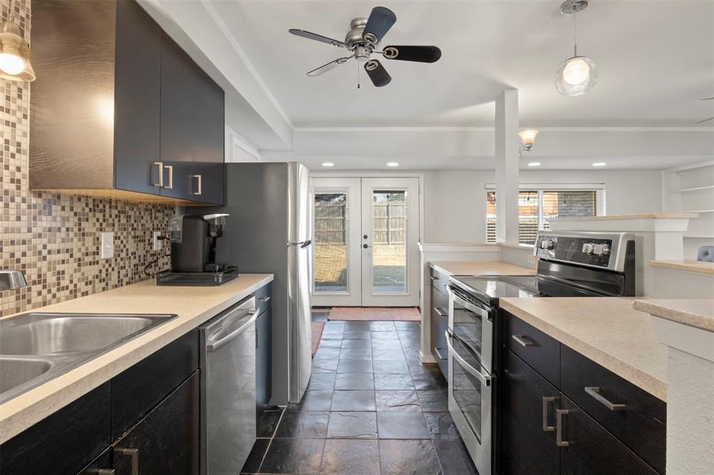 3518 Windsor Street Irving, TX 75062 - Photo 5 of 21 a kitchen with a sink stove and refrigerator