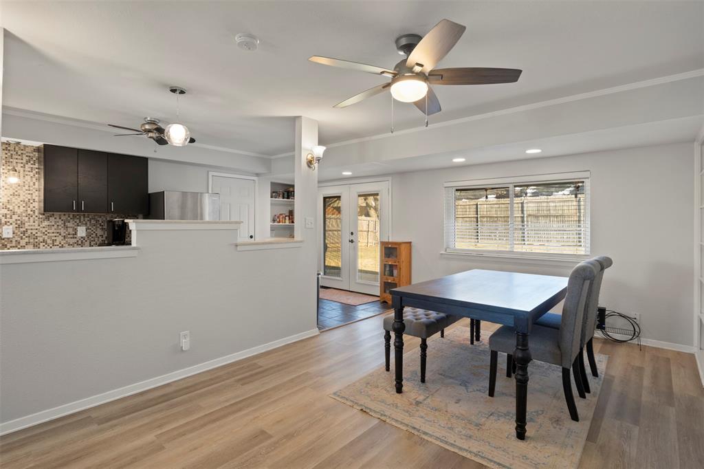 3518 Windsor Street Irving, TX 75062 - Photo 9 of 21 a view of a dining room with furniture window and wooden floor