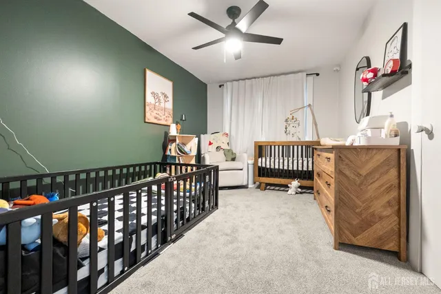 a view of a livingroom with furniture and windows