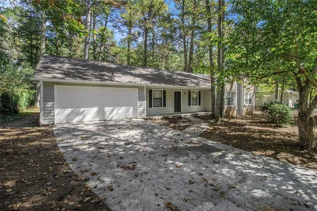 a view of a house with a tree