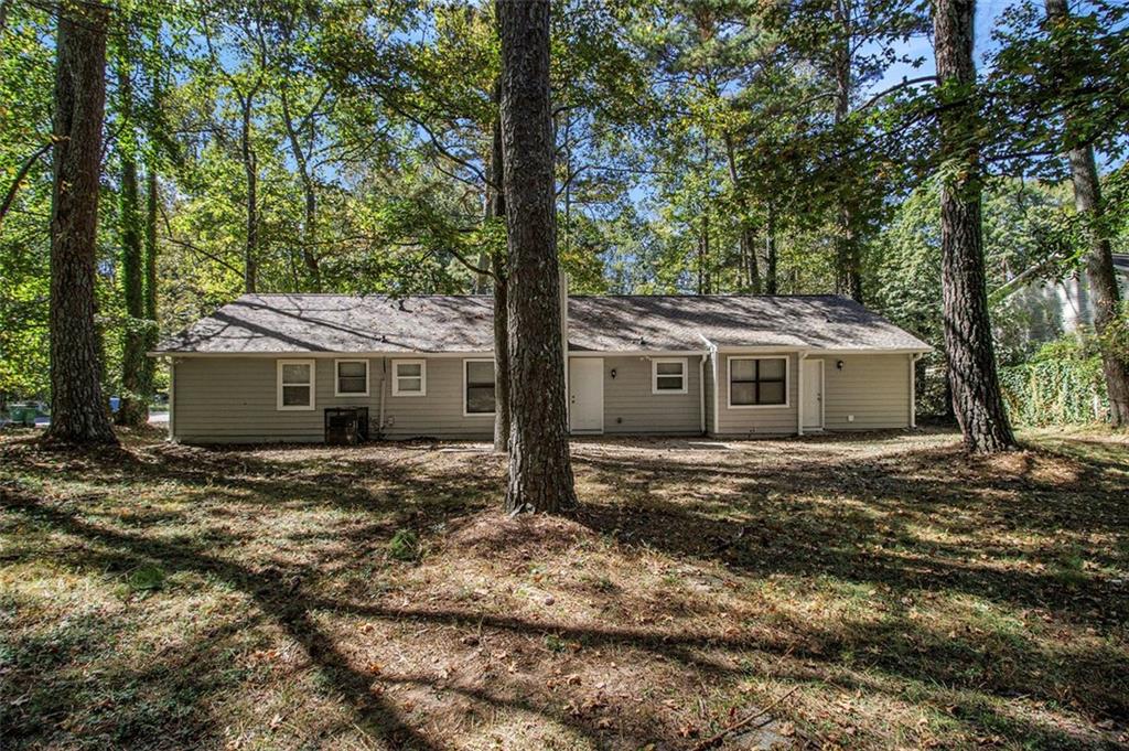 1748 Charmeth Road Lithonia, GA 30058 - Photo 27 of 32 a view of a house with a yard