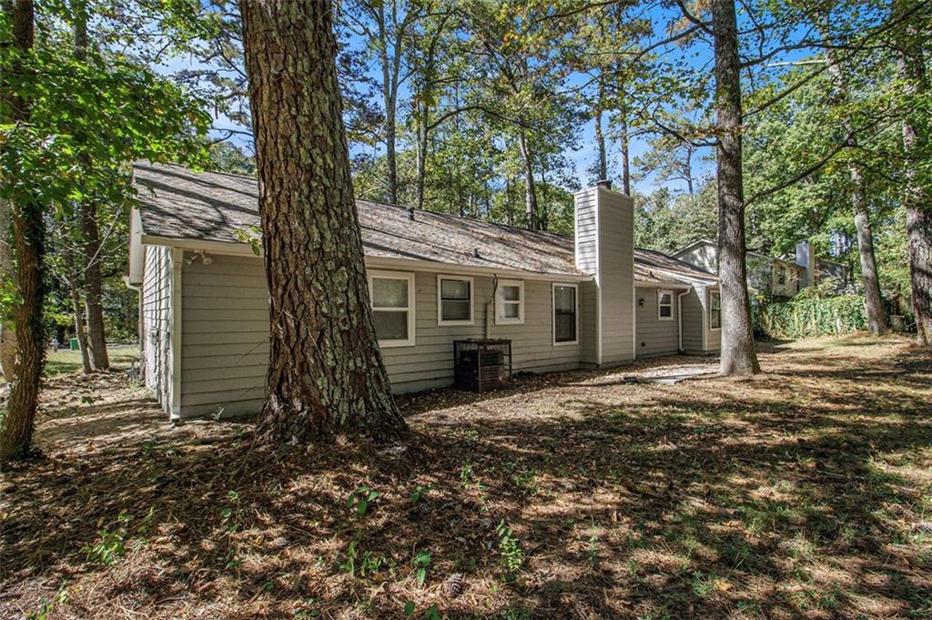 1748 Charmeth Road Lithonia, GA 30058 - Photo 28 of 32 a front view of a house with garden