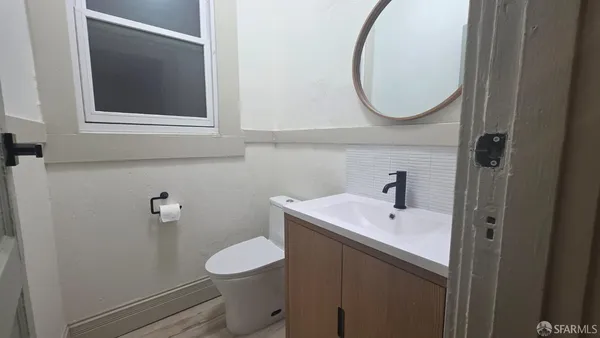 a spacious bedroom with a bed and window
