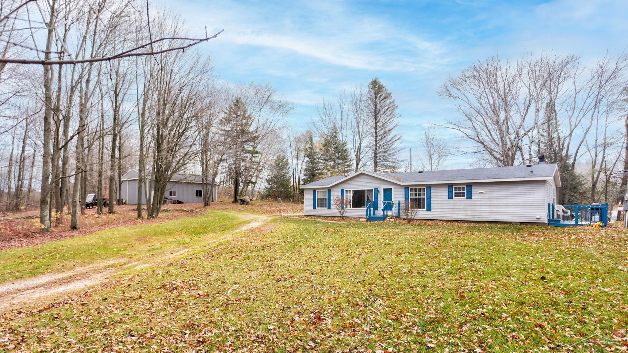 1634 East Mannsiding Road Harrison, MI 48625 - Photo 1 of 25