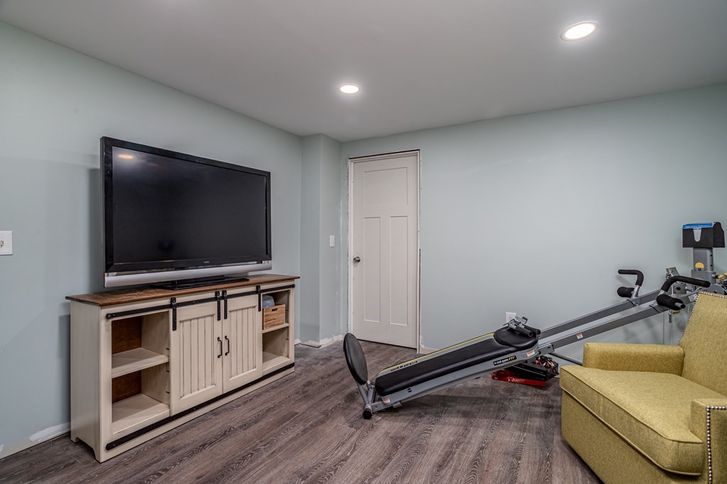 145 Tuckerman Road Ashburnham, MA 01430 - Photo 36 of 42 a living room with furniture and a flat screen tv