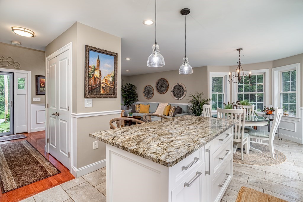 145 Tuckerman Road Ashburnham, MA 01430 - Photo 8 of 42 a kitchen with a table and chairs in it