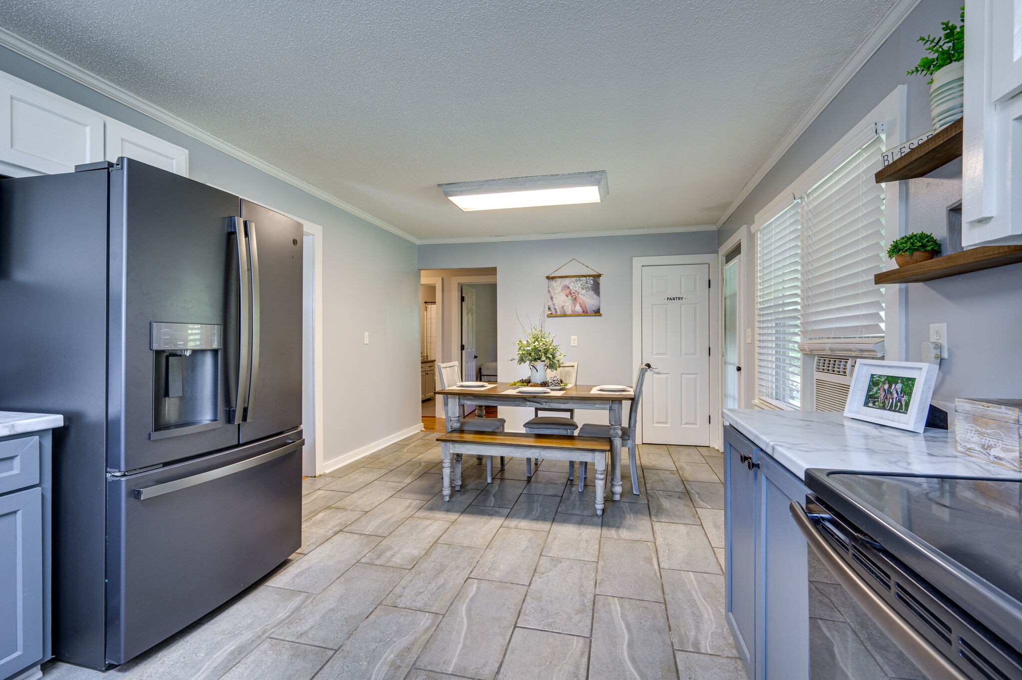 2558 Chisholm Road Iron City, TN 38463 - Photo 11 of 35 a kitchen with kitchen island granite countertop a sink appliances and cabinets