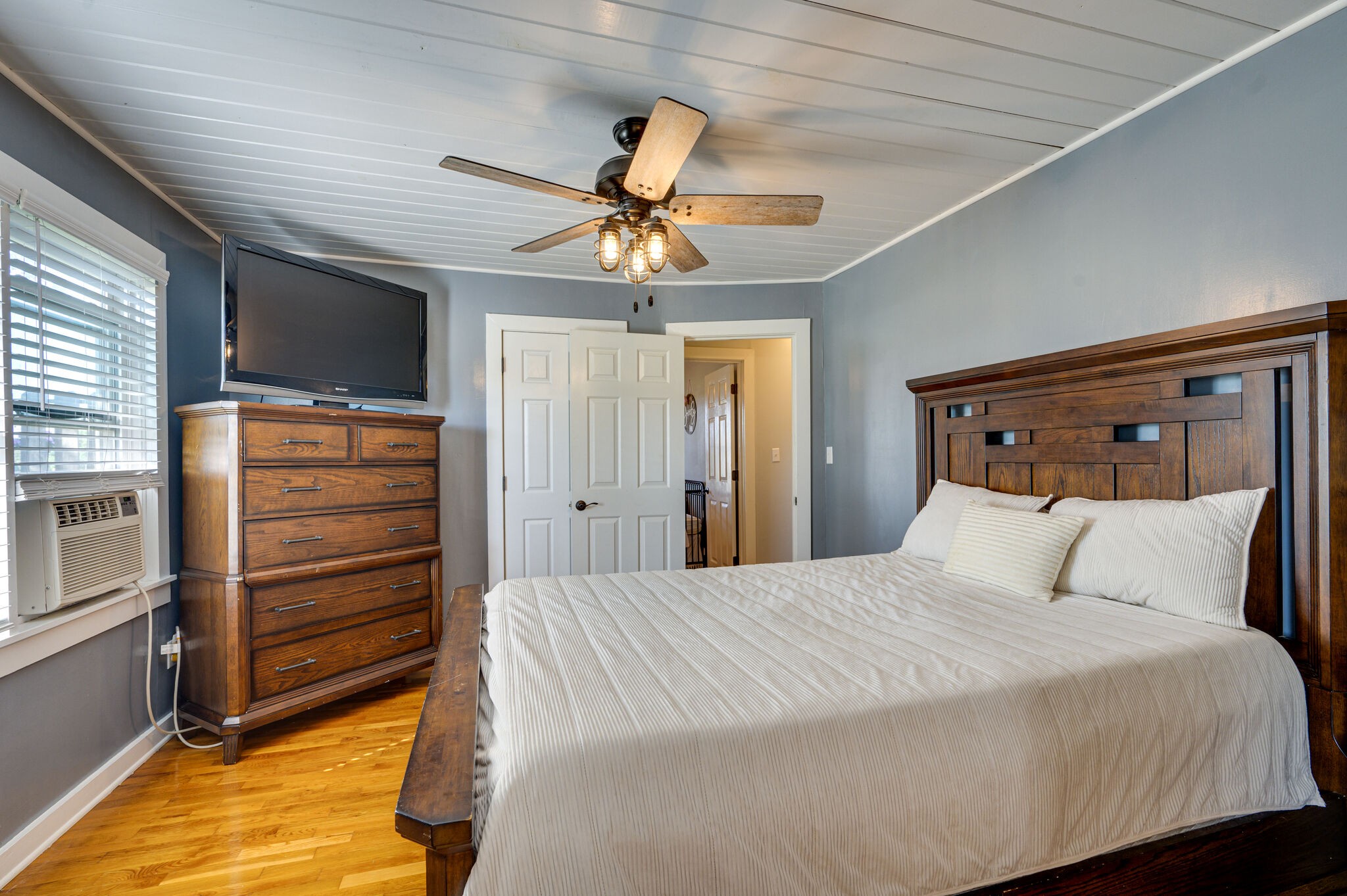 2558 Chisholm Road Iron City, TN 38463 - Photo 15 of 35 a bedroom with a bed and a chandelier