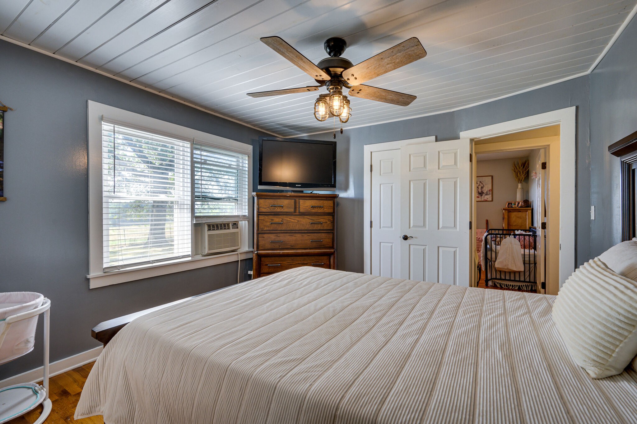 2558 Chisholm Road Iron City, TN 38463 - Photo 16 of 35 a bedroom with a bed and a chandelier