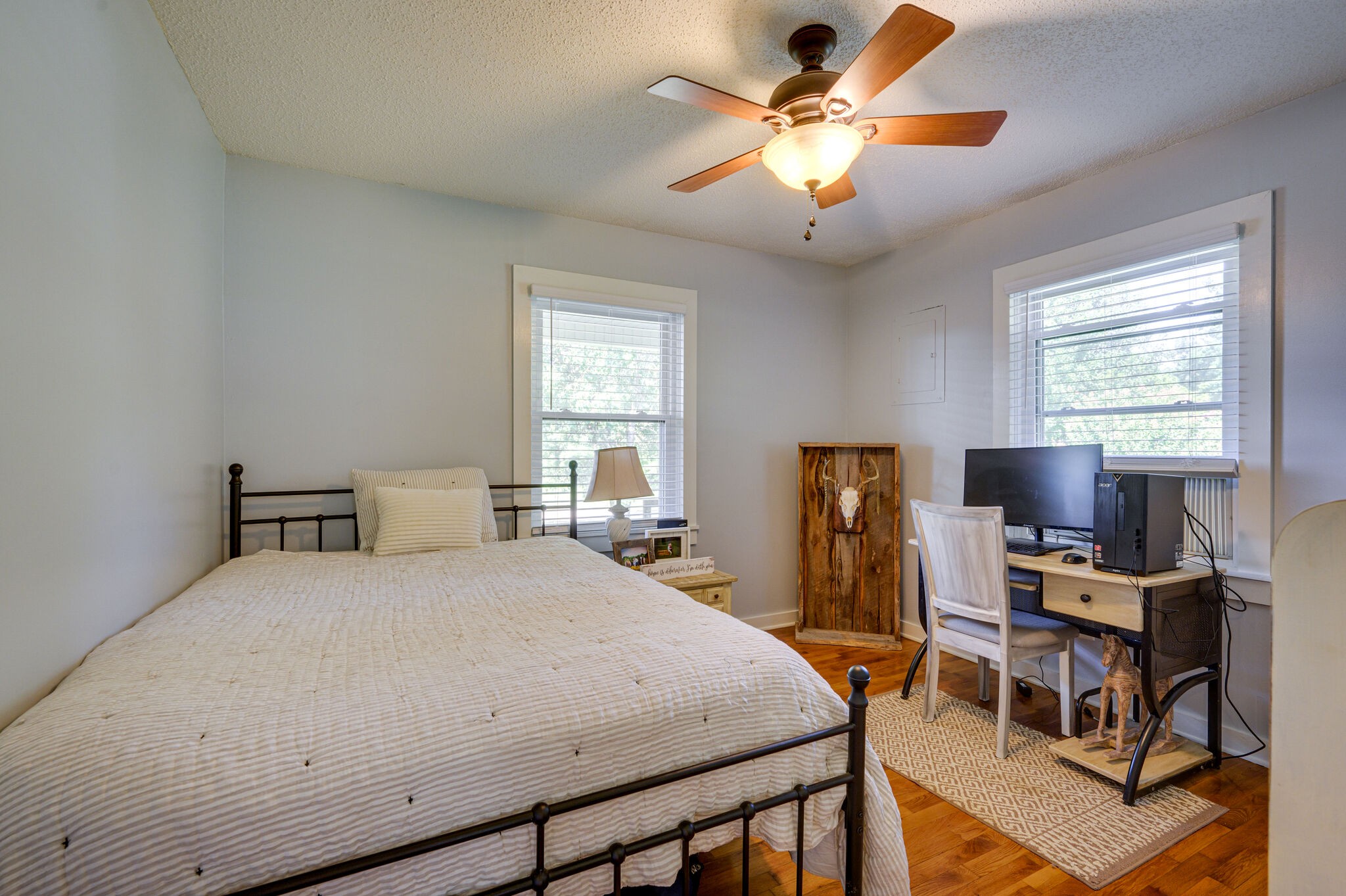 2558 Chisholm Road Iron City, TN 38463 - Photo 19 of 35 a bedroom with a bed and a chandelier