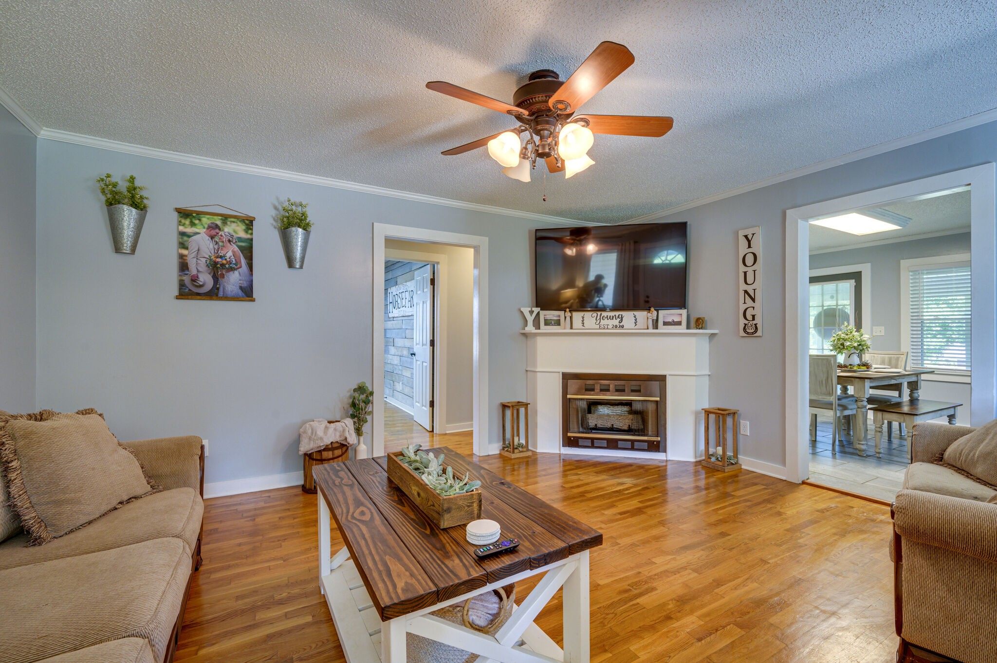 2558 Chisholm Road Iron City, TN 38463 - Photo 8 of 35 a living room with furniture a fireplace and a flat screen tv