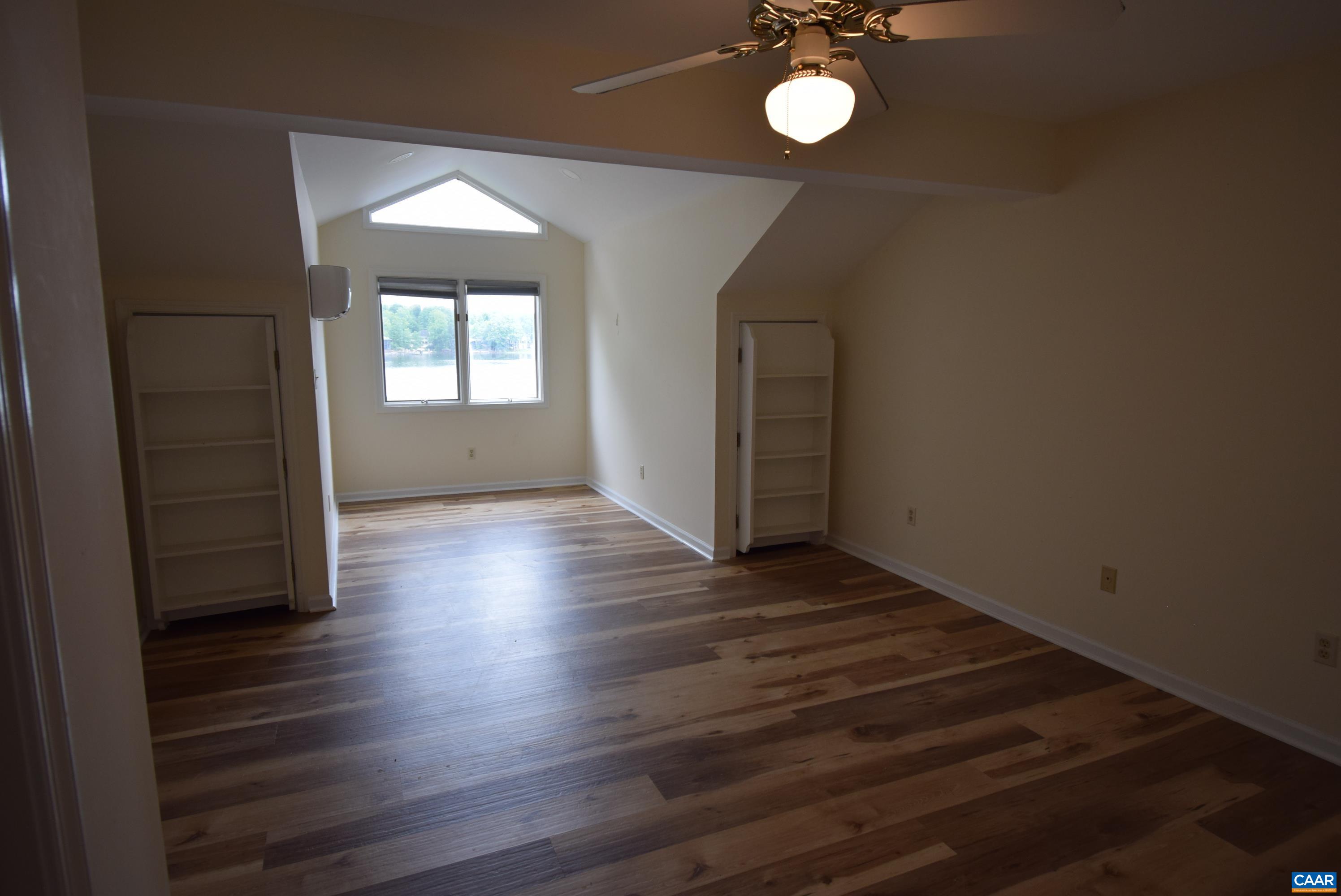 B3 Marina Point Palmyra, VA 22963 - Photo 18 of 31 an empty room with wooden floor and windows