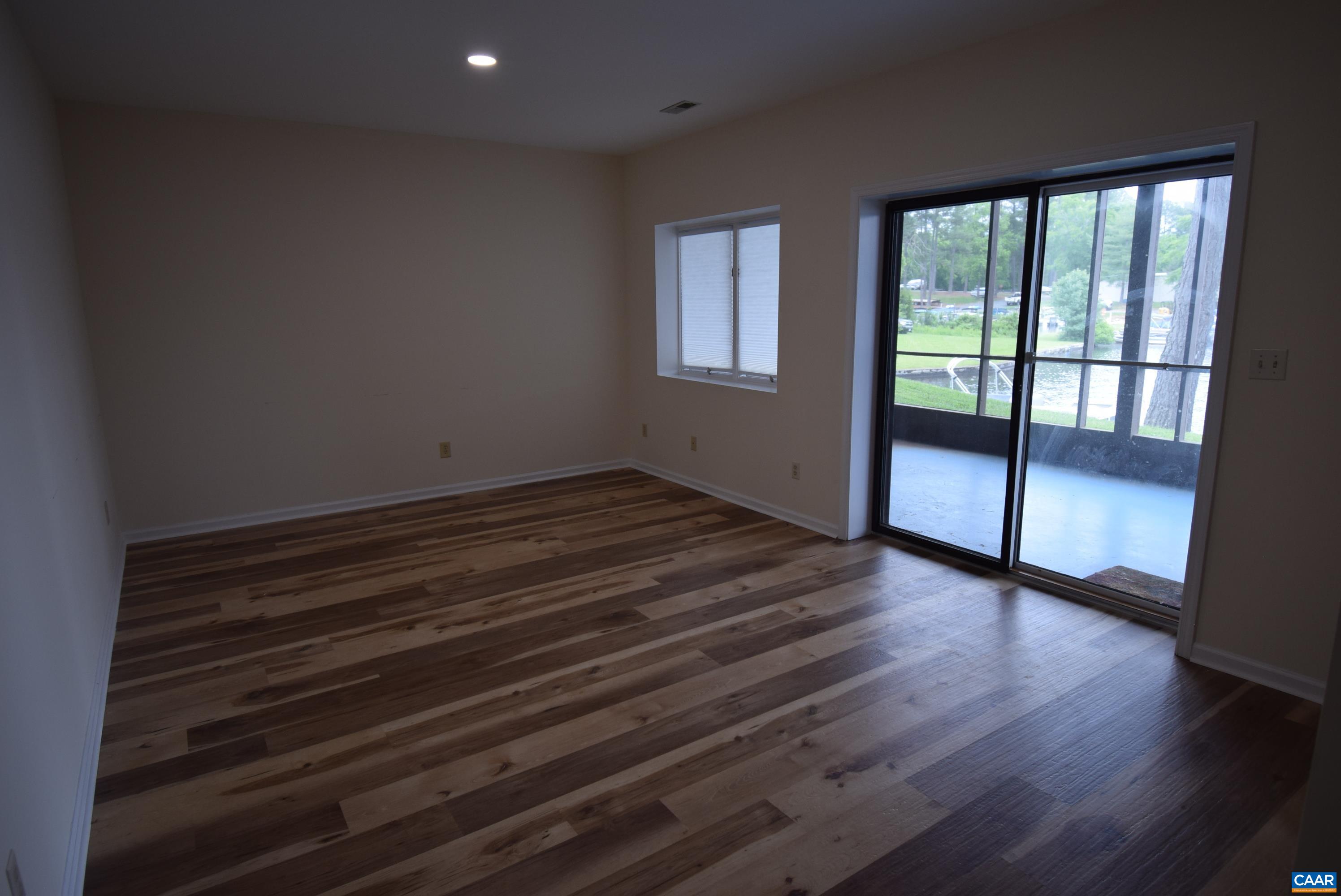 B3 Marina Point Palmyra, VA 22963 - Photo 25 of 31 a view of empty room with wooden floor and fan