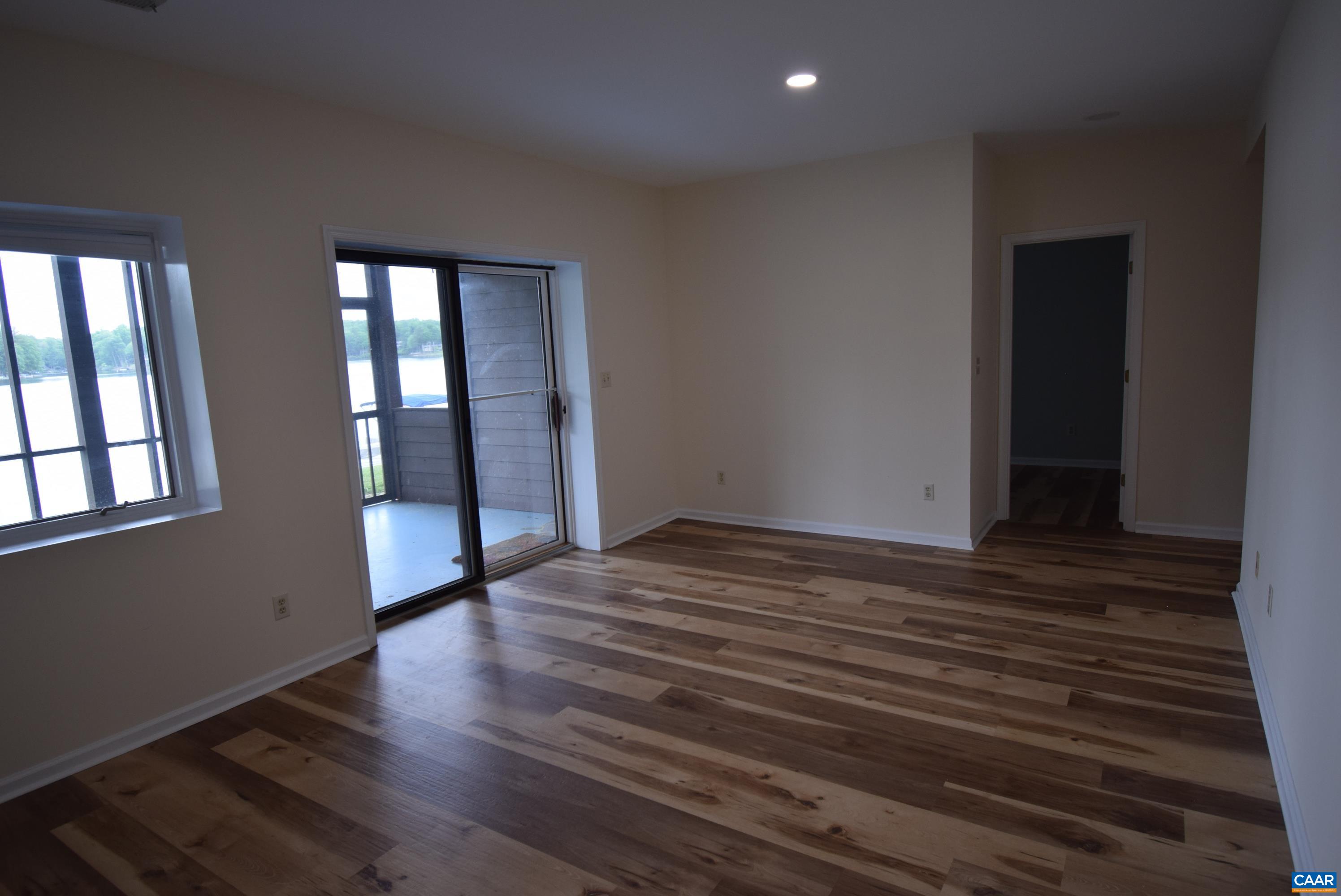 B3 Marina Point Palmyra, VA 22963 - Photo 26 of 31 a view of an empty room with wooden floor and a window
