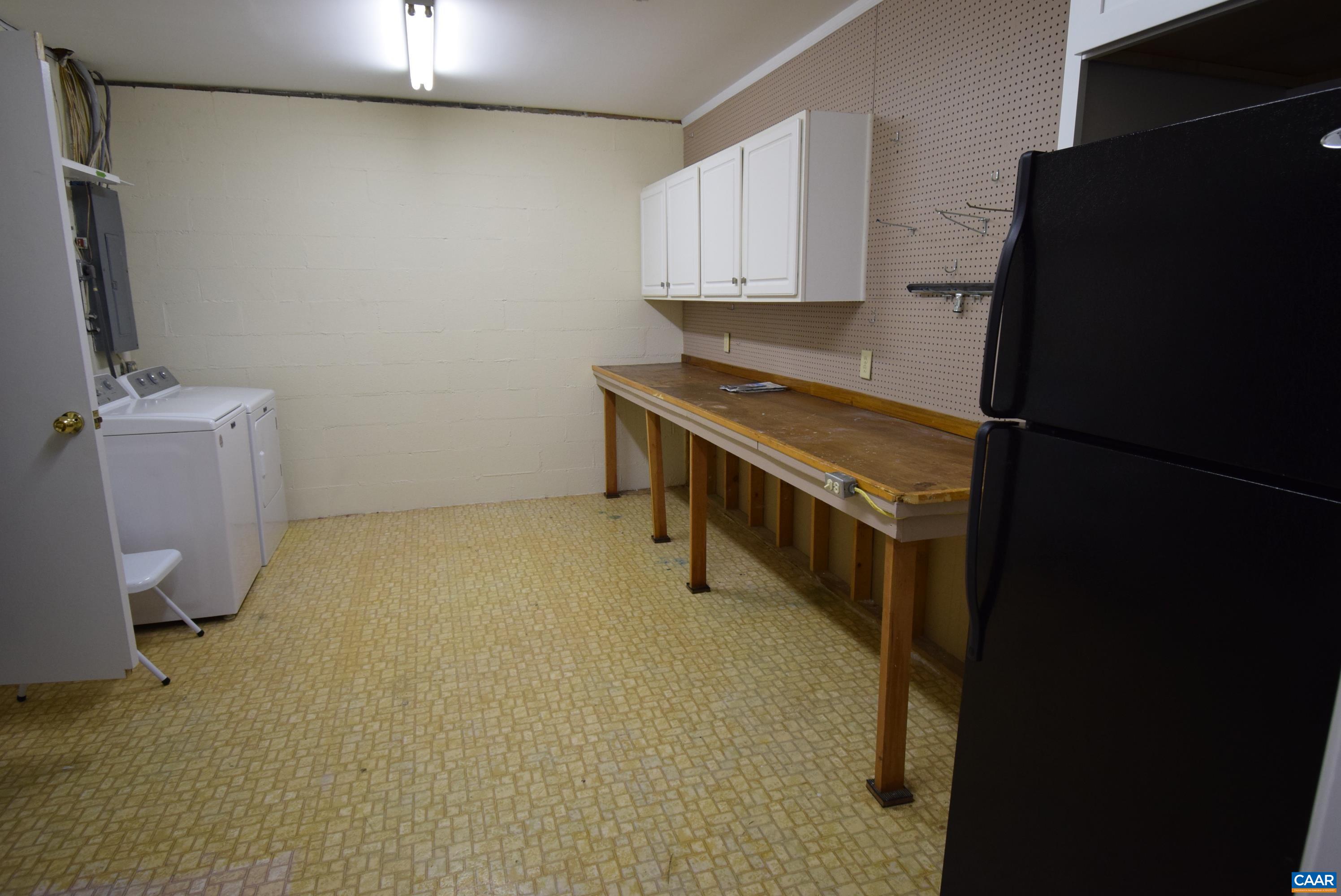 B3 Marina Point Palmyra, VA 22963 - Photo 29 of 31 a view of a kitchen with a sink cabinets and a window