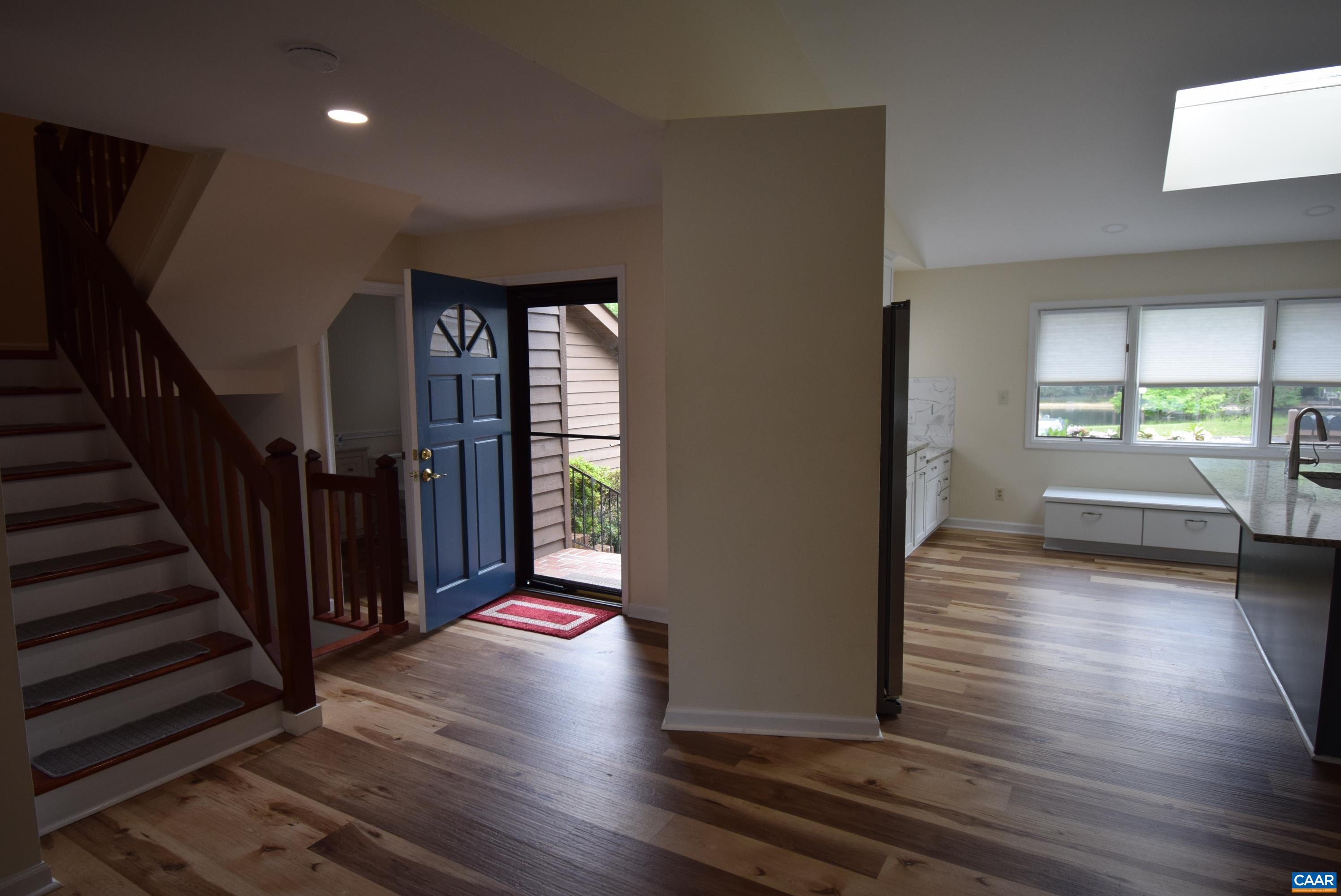 B3 Marina Point Palmyra, VA 22963 - Photo 3 of 31 a view of a hallway view with wooden floor and staircase