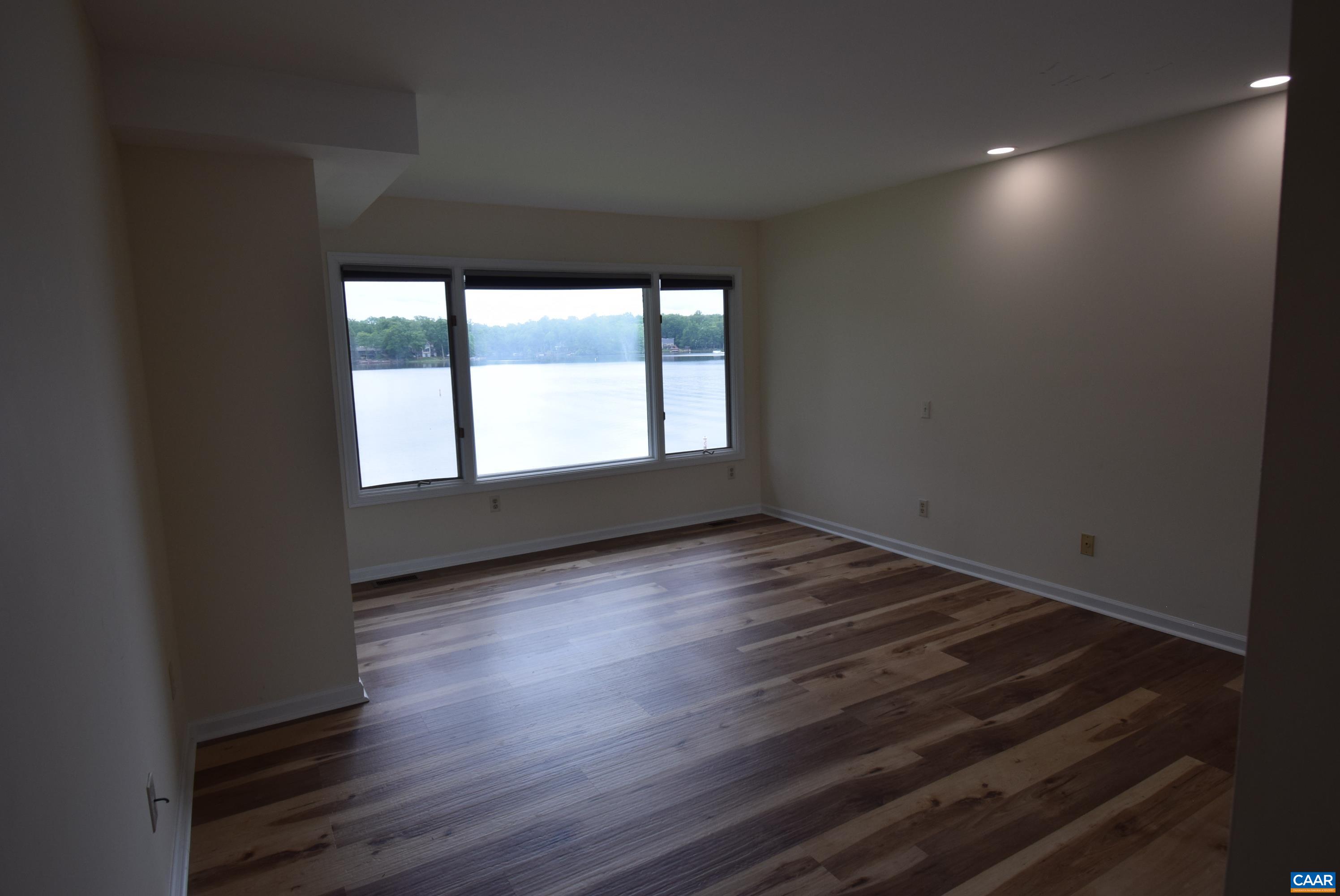 B3 Marina Point Palmyra, VA 22963 - Photo 9 of 31 a view of an empty room and wooden floor and a window