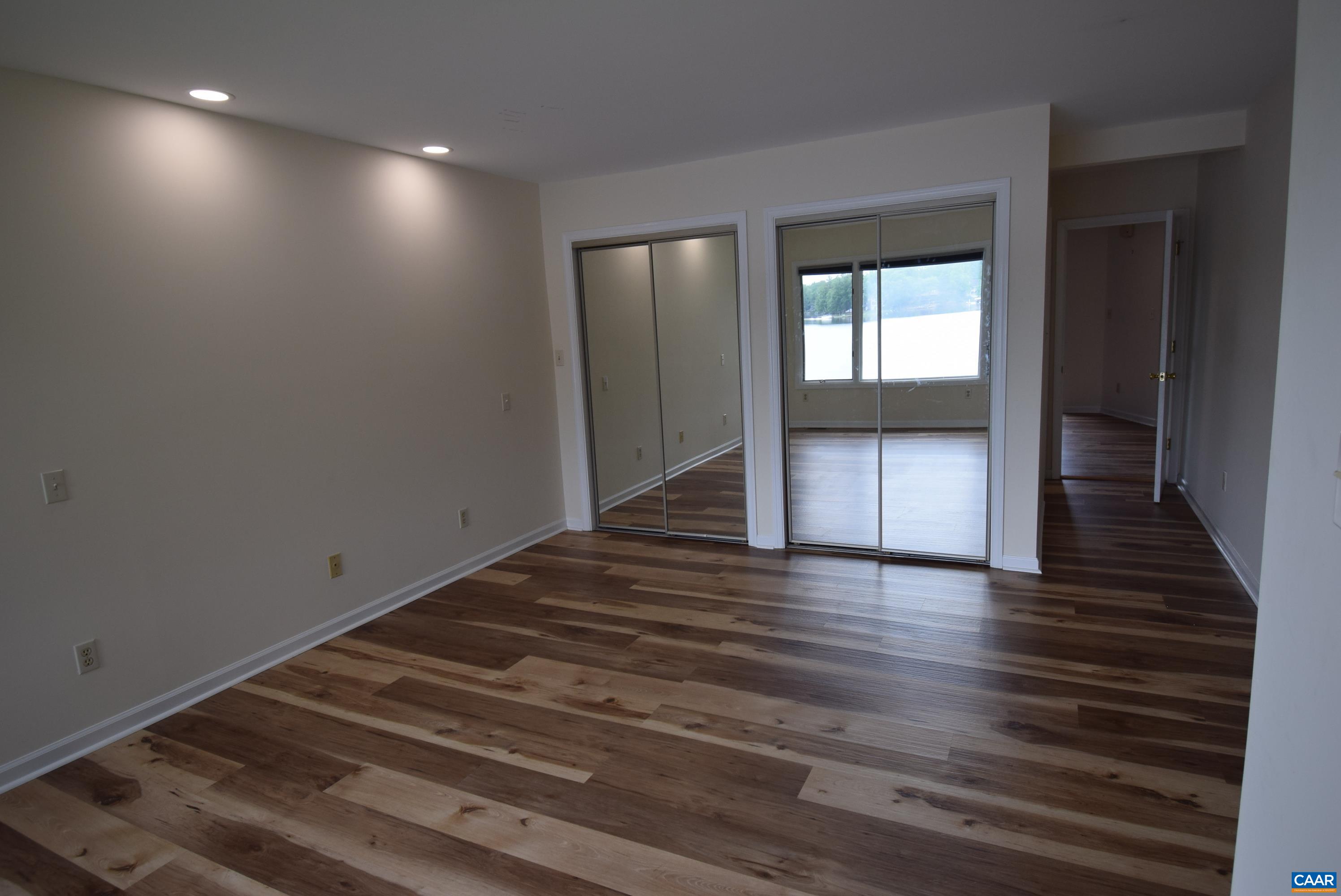B3 Marina Point Palmyra, VA 22963 - Photo 10 of 31 a view of an empty room with wooden floor and a window