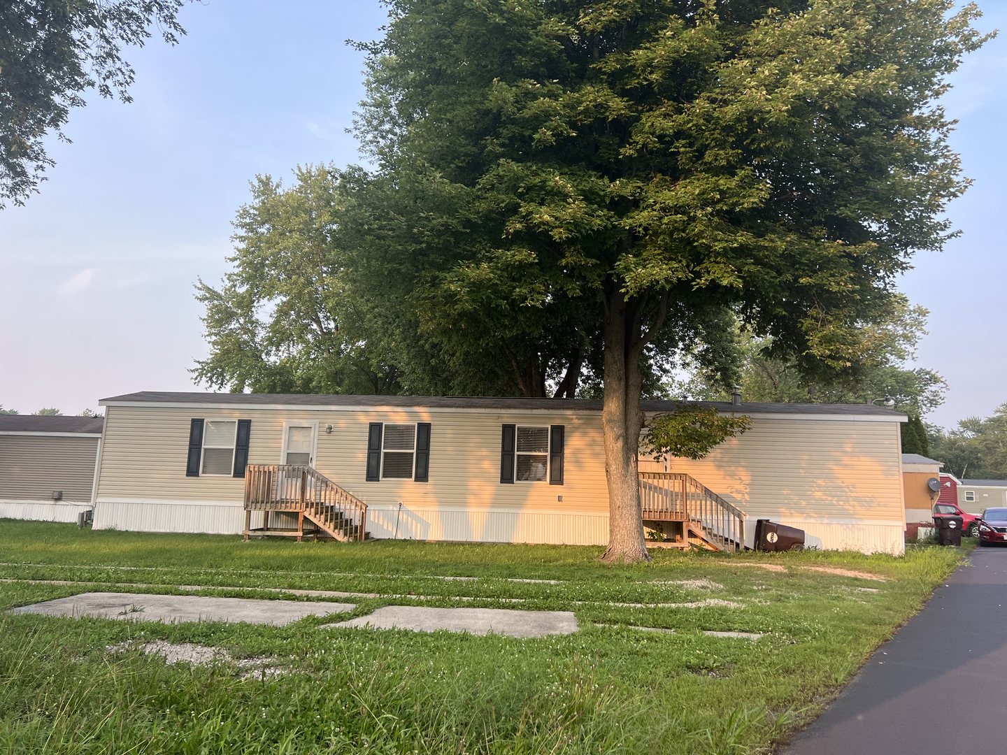 a front view of house with yard and green space