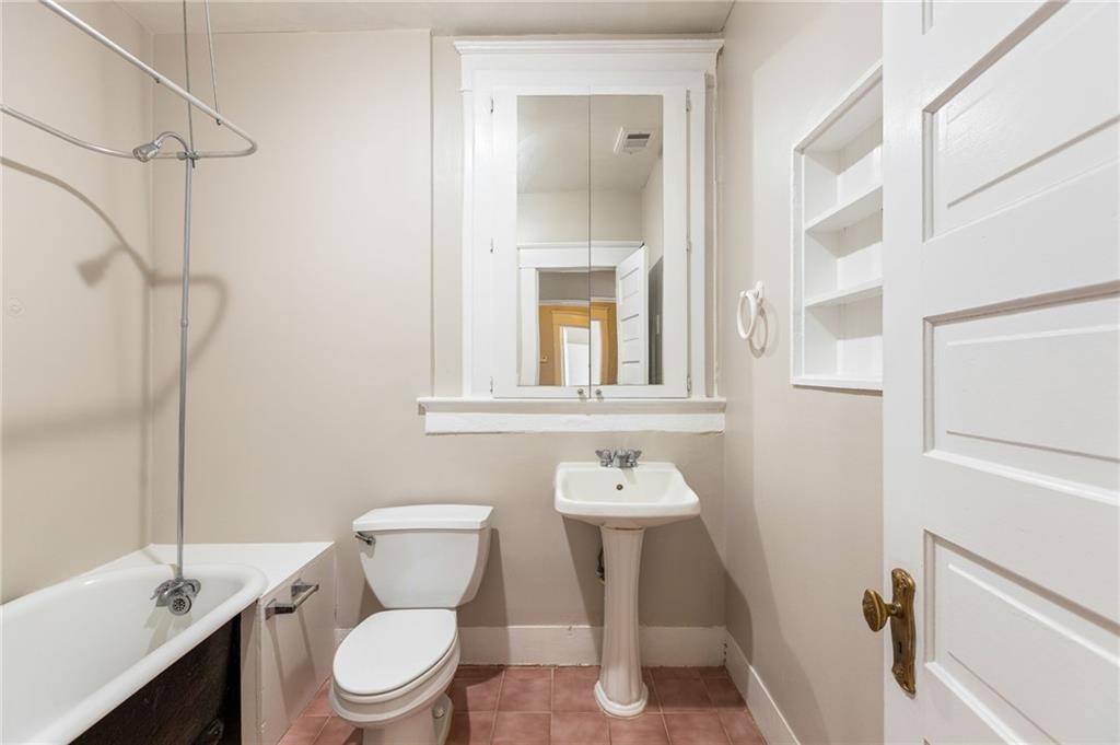 120 South Candler Street Decatur, GA 30030 - Photo 29 of 40 a white toilet sitting next to a bathroom sink