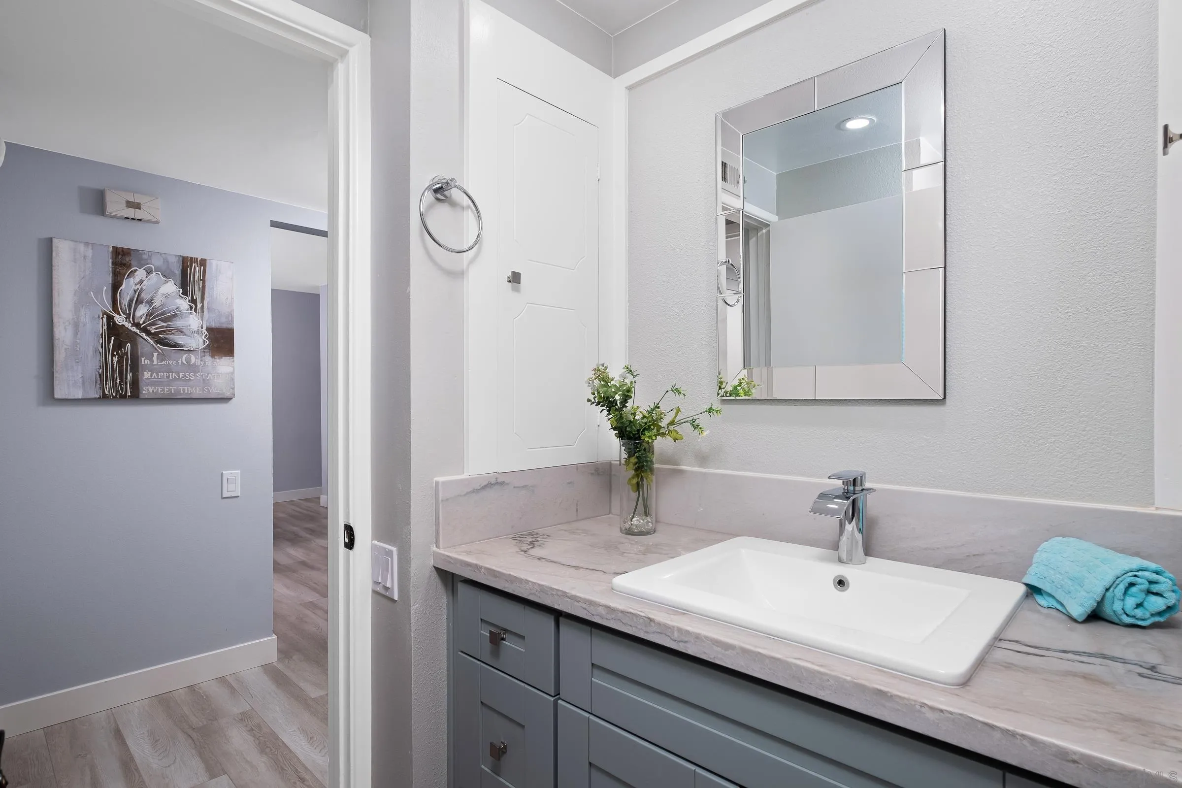 12176 Rancho Bernardo Road, Unit B San Diego, CA 92128 - Photo 13 of 41 a bathroom with a granite countertop sink and a mirror