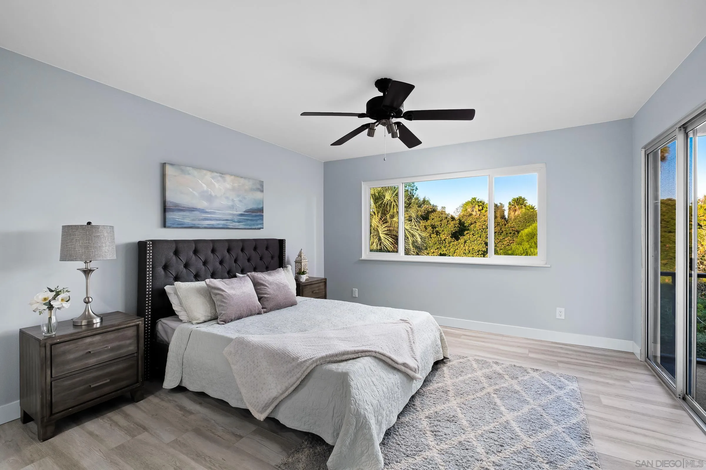 12176 Rancho Bernardo Road, Unit B San Diego, CA 92128 - Photo 16 of 41 a bedroom with a bed and a window