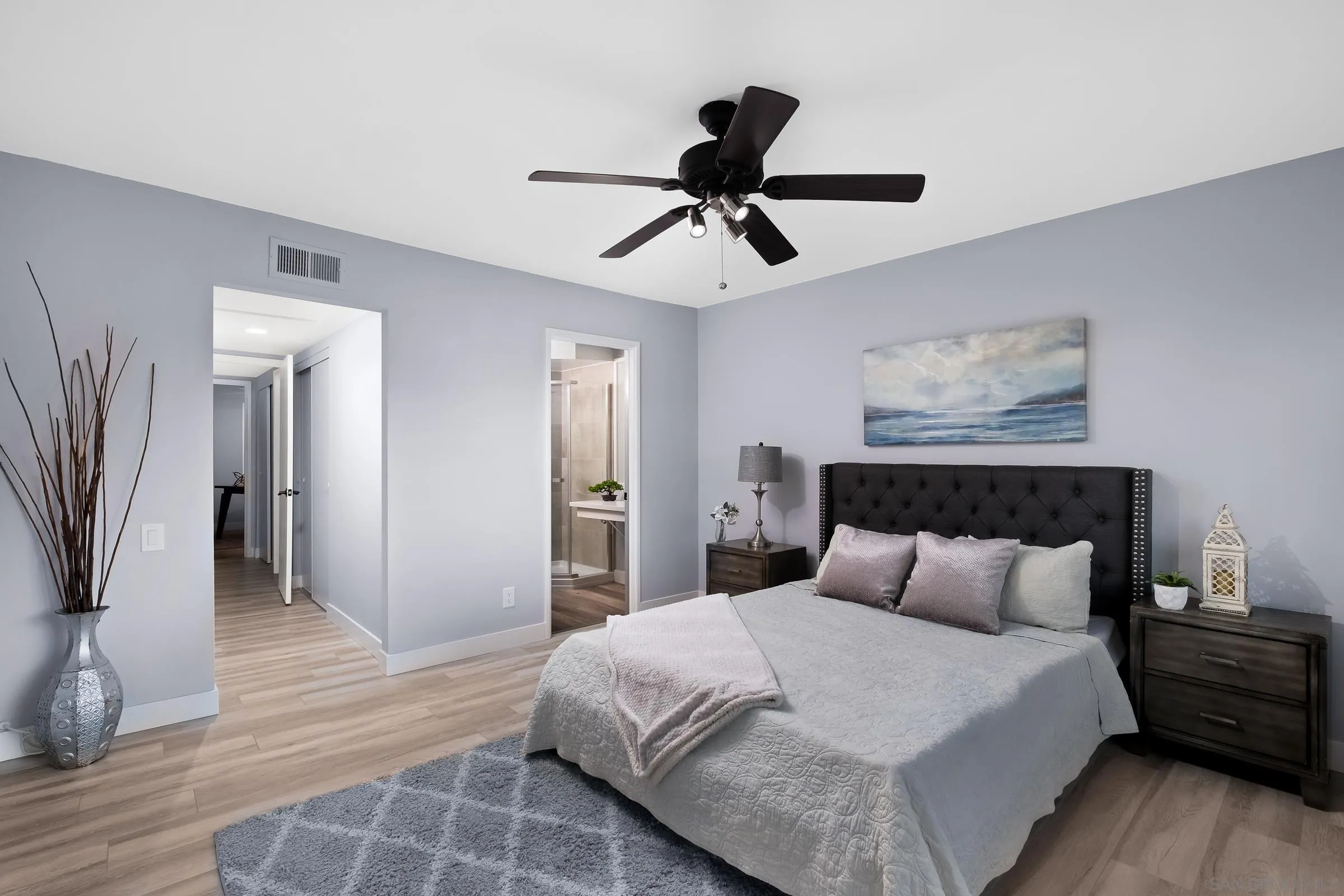 12176 Rancho Bernardo Road, Unit B San Diego, CA 92128 - Photo 17 of 41 a bedroom with a bed and a walk in closet