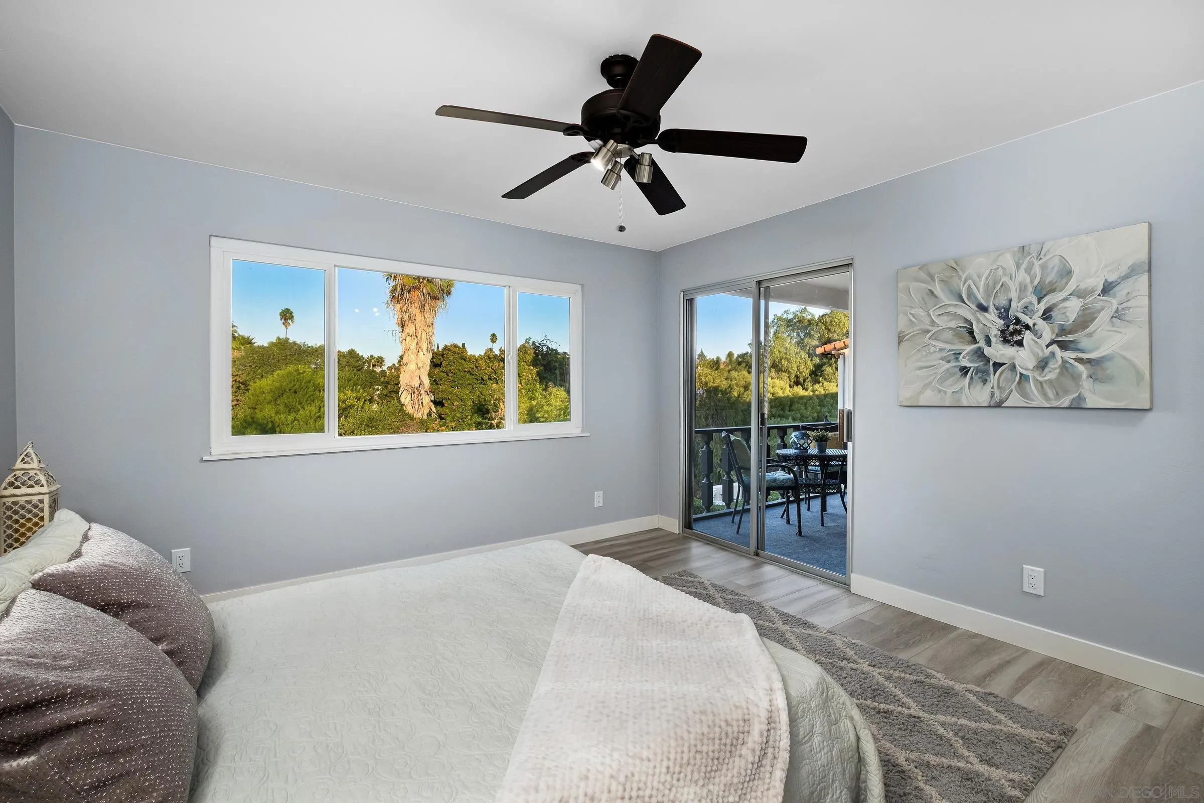 12176 Rancho Bernardo Road, Unit B San Diego, CA 92128 - Photo 18 of 41 a bedroom with a bed and a window
