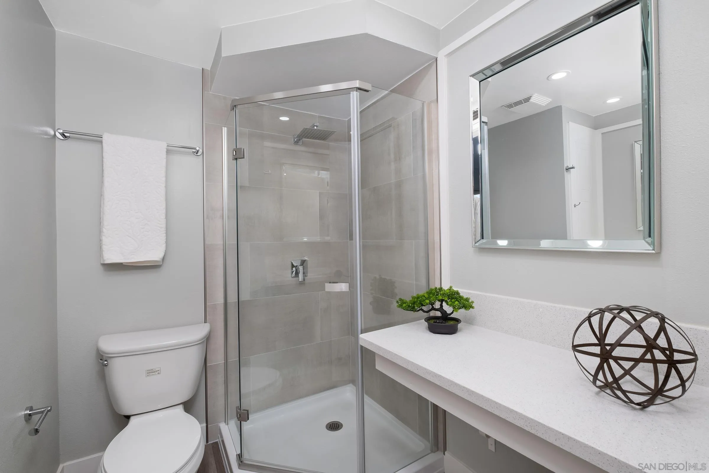 12176 Rancho Bernardo Road, Unit B San Diego, CA 92128 - Photo 19 of 41 a bathroom with a sink toilet and shower