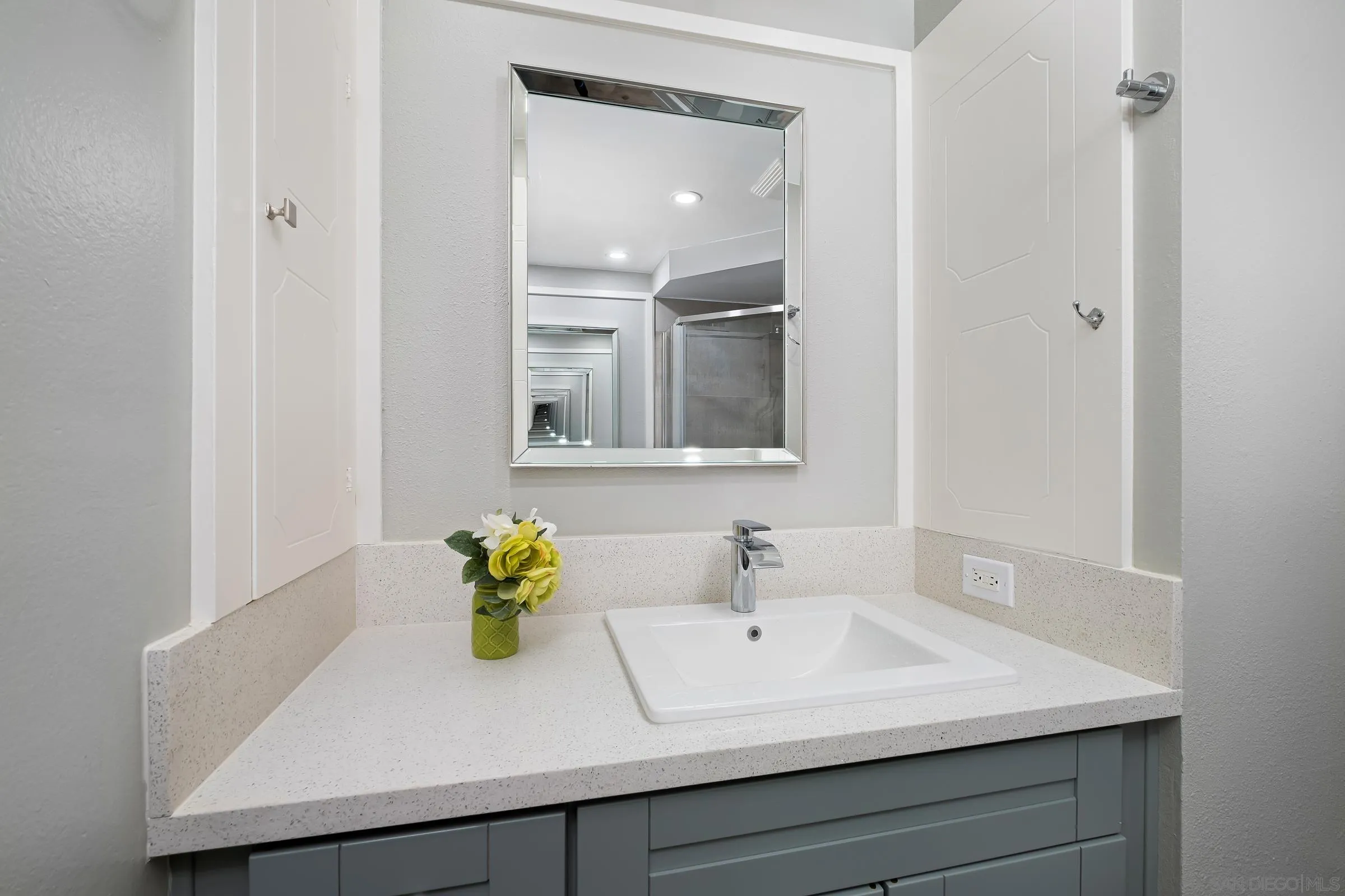 12176 Rancho Bernardo Road, Unit B San Diego, CA 92128 - Photo 20 of 41 a bathroom with a sink and a mirror