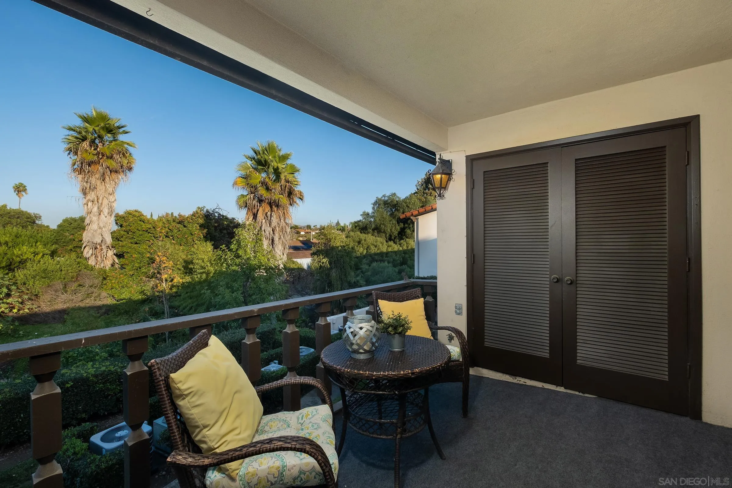 12176 Rancho Bernardo Road, Unit B San Diego, CA 92128 - Photo 23 of 41 a view of a chair and tables in the balcony