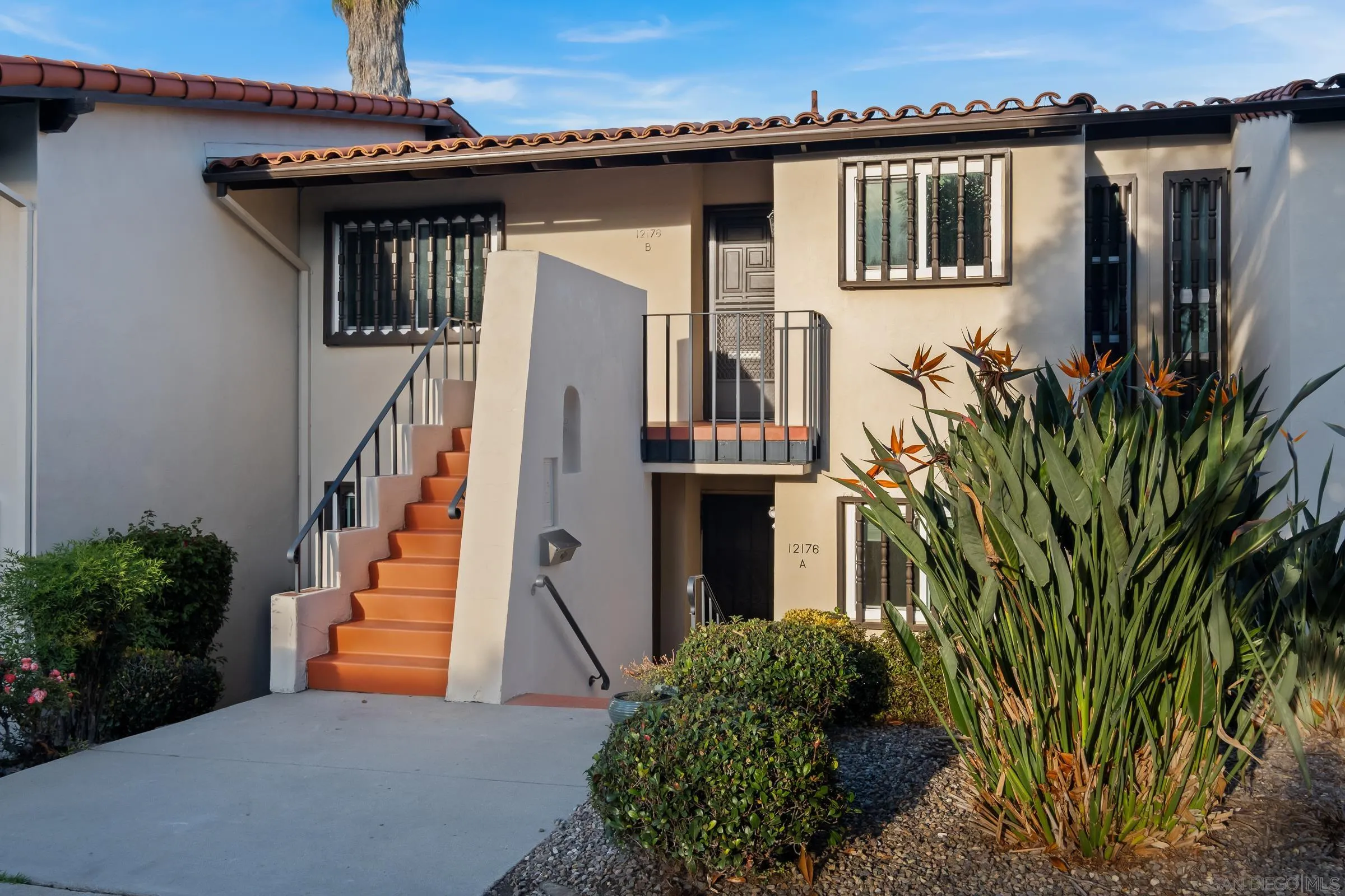 12176 Rancho Bernardo Road, Unit B San Diego, CA 92128 - Photo 26 of 41 a front view of a house with a garden