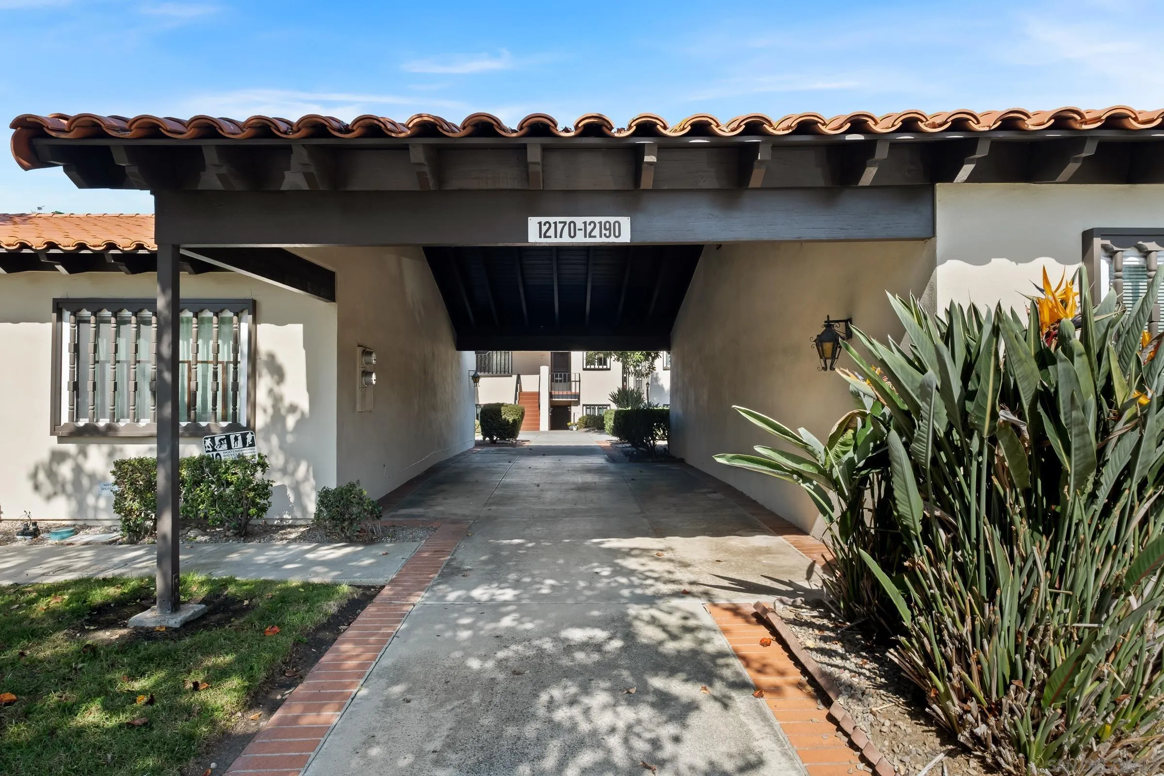 12176 Rancho Bernardo Road, Unit B San Diego, CA 92128 - Photo 3 of 41 an outdoor view of house with yard