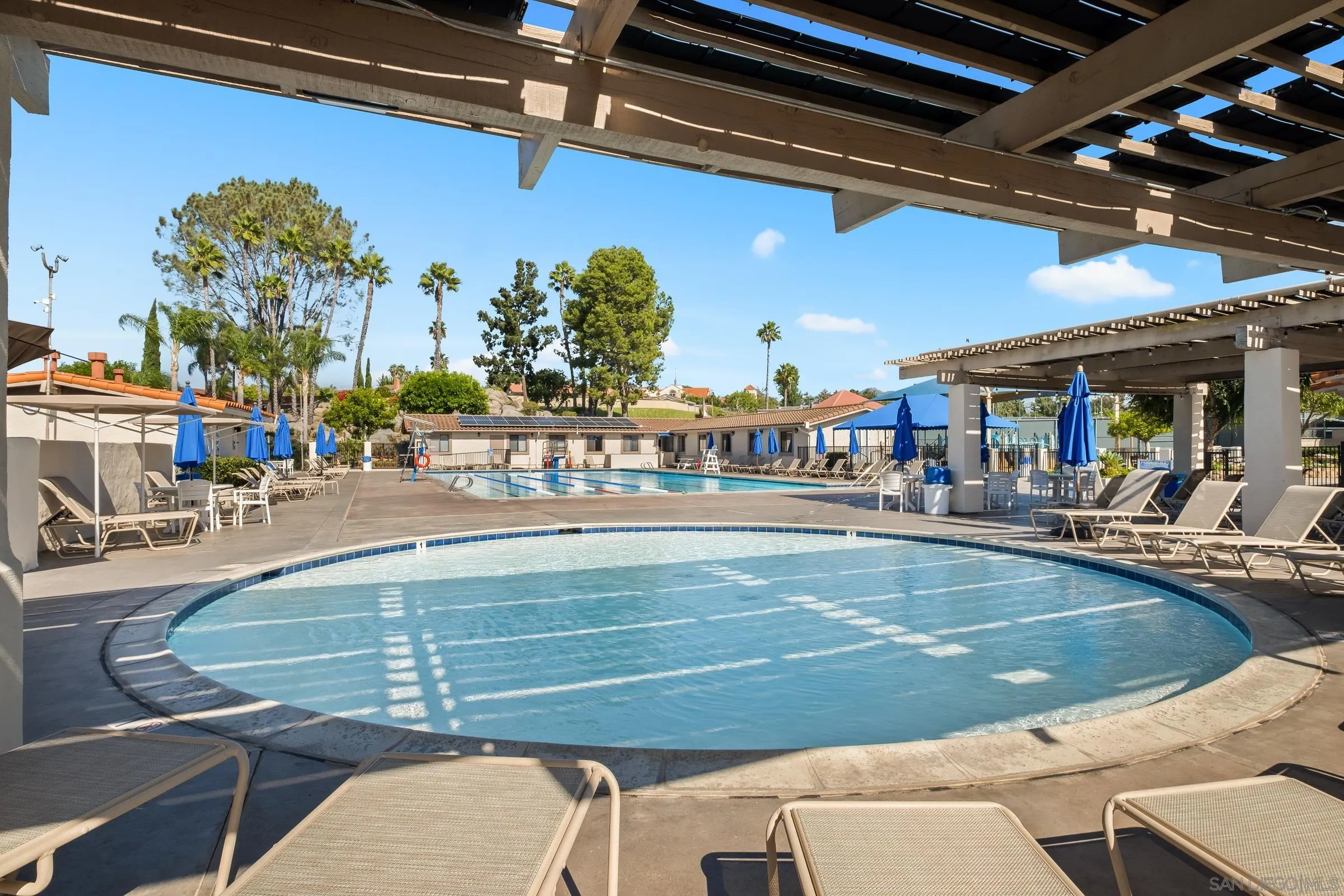 12176 Rancho Bernardo Road, Unit B San Diego, CA 92128 - Photo 39 of 41 a view of a swimming pool with outdoor seating