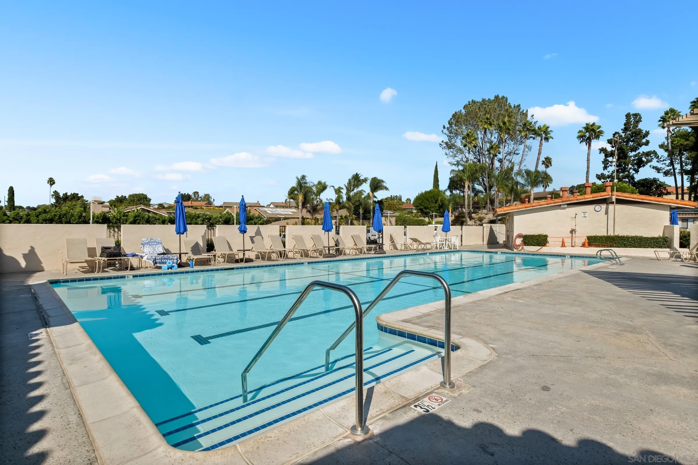 12176 Rancho Bernardo Road, Unit B San Diego, CA 92128 - Photo 40 of 41 a view of swimming pool with outdoor seating and trees in the background