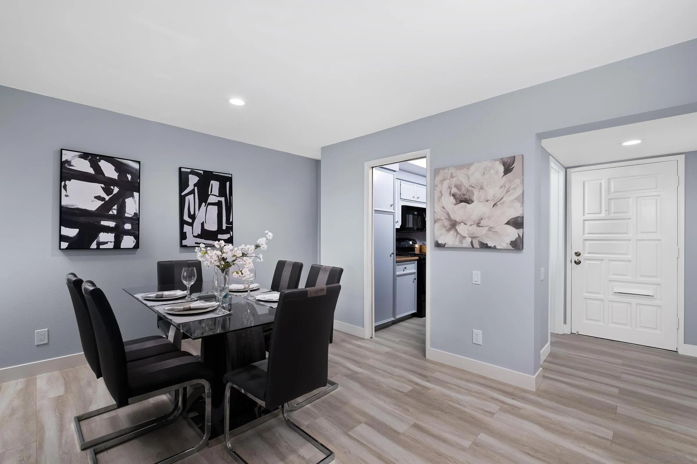 12176 Rancho Bernardo Road, Unit B San Diego, CA 92128 - Photo 7 of 41 a dining room with furniture and wooden floor