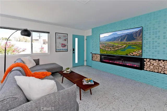 a bedroom with a bed and painting on the wall